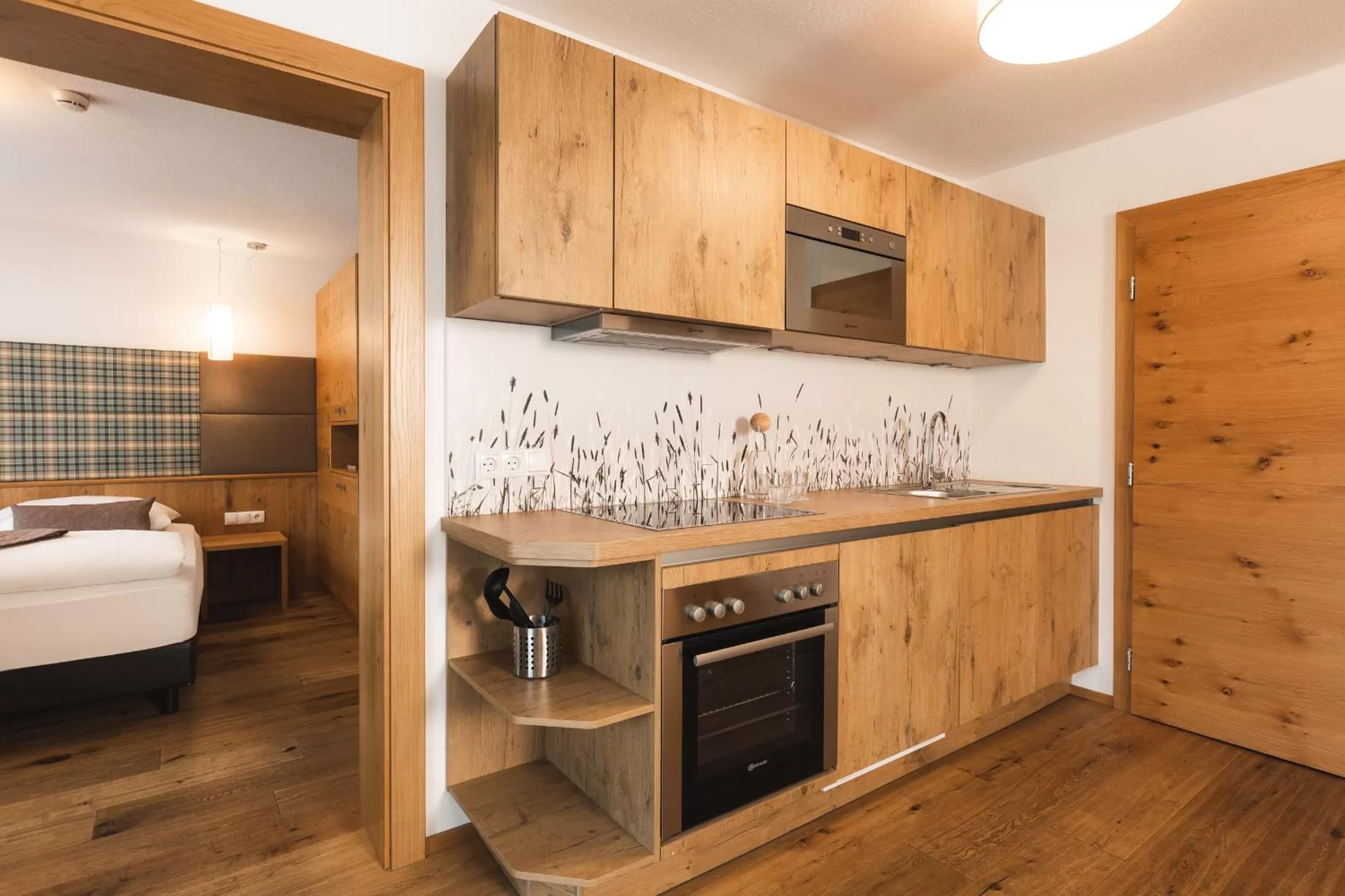 Kitchen or kitchenette, Bed in Hotel Enzian