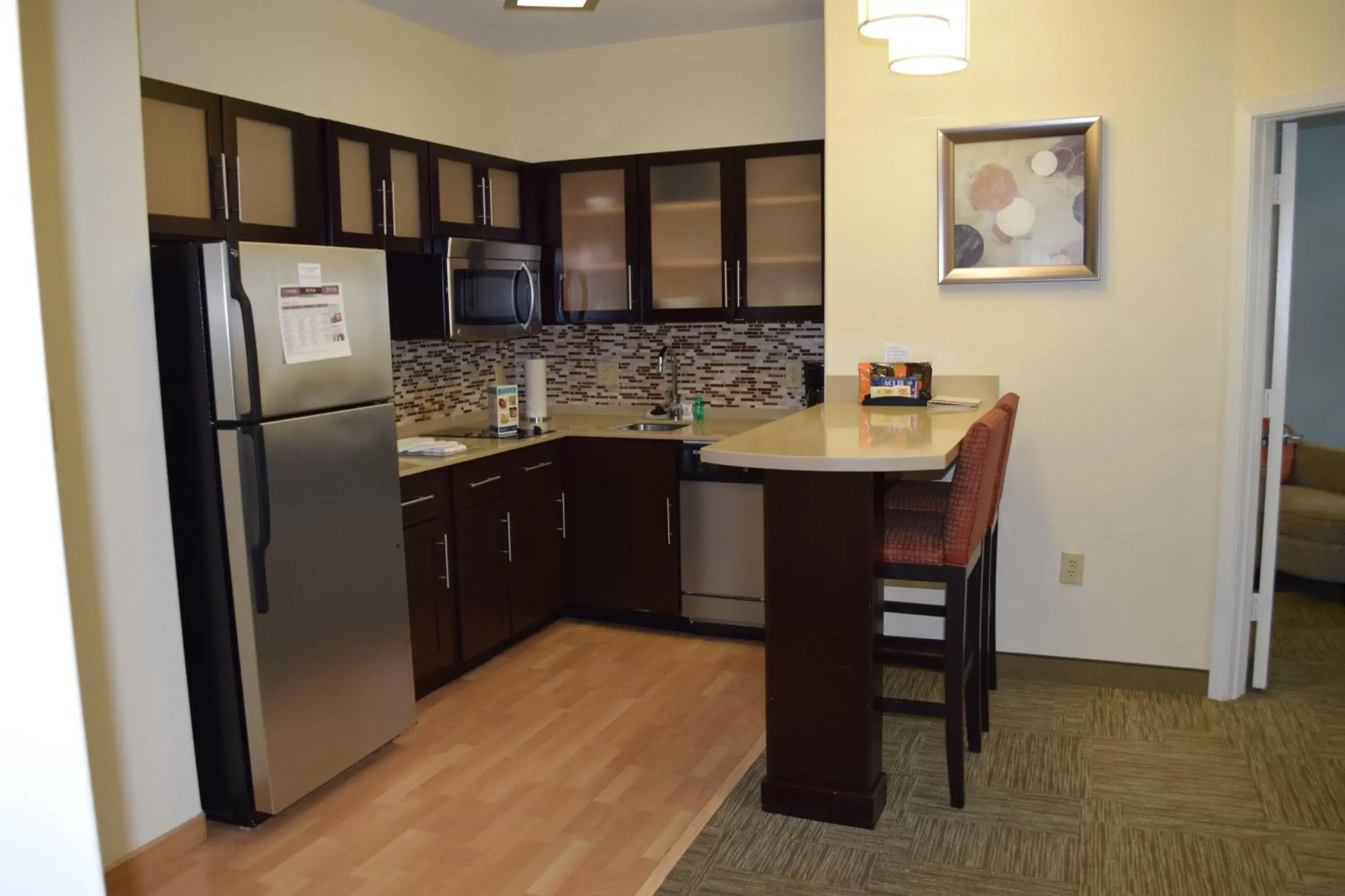 Photo of the whole room, Kitchen/Kitchenette in Staybridge Suites Houston Stafford - Sugar Land, an IHG Hotel