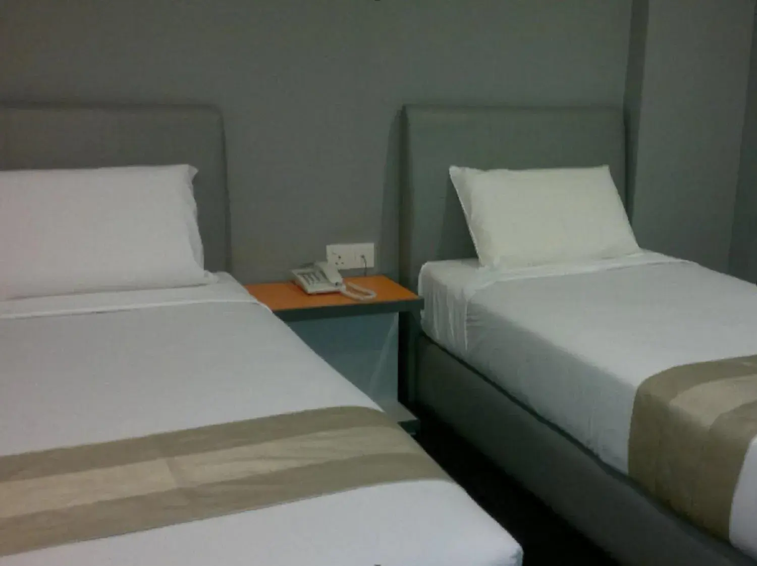 Bed in U Pac Hotel