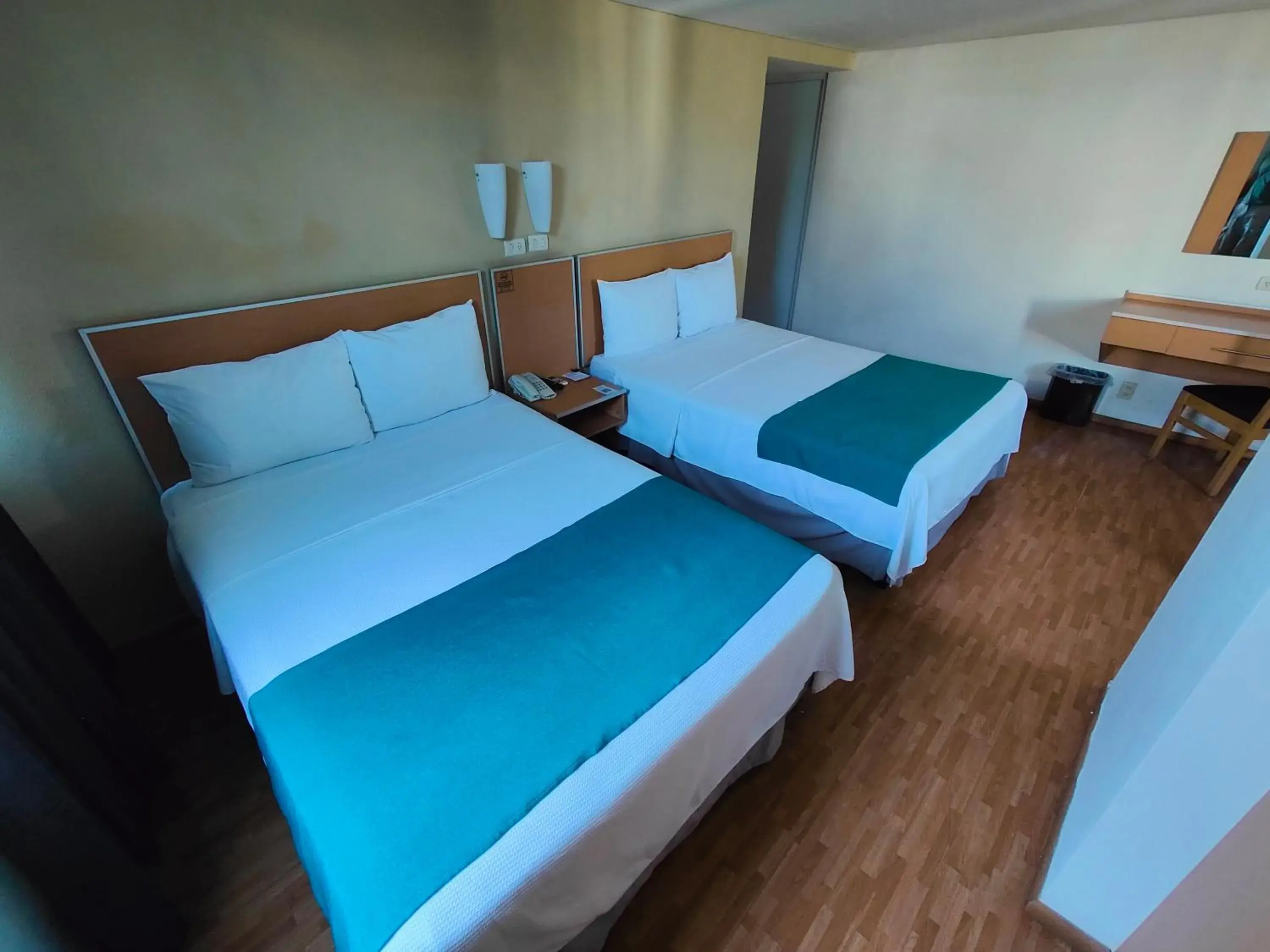 Bed in Kasa Hotel & Suites