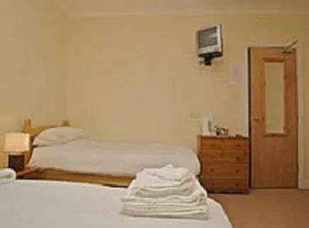 Bedroom in All Seasons Lodge Hotel