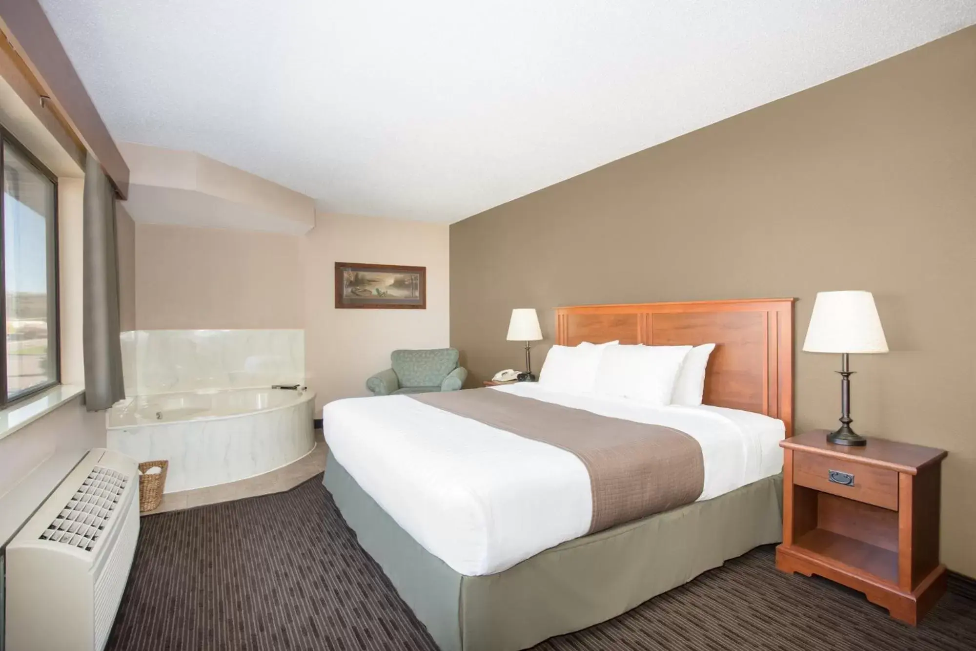 Bed in AmericInn by Wyndham Sioux City