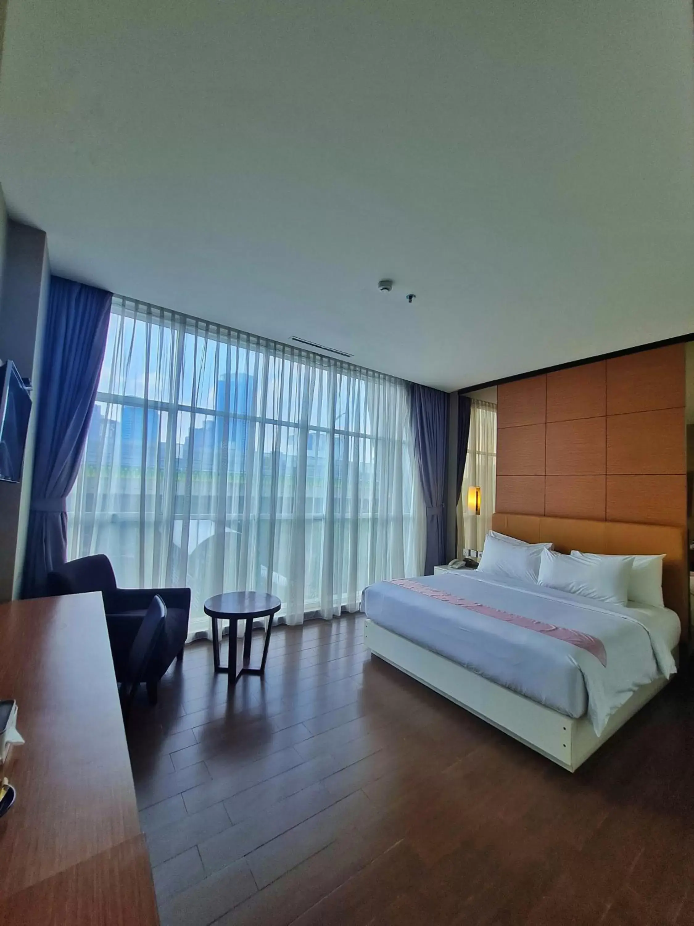 Bed in Terraz Tree Hotel Jakarta