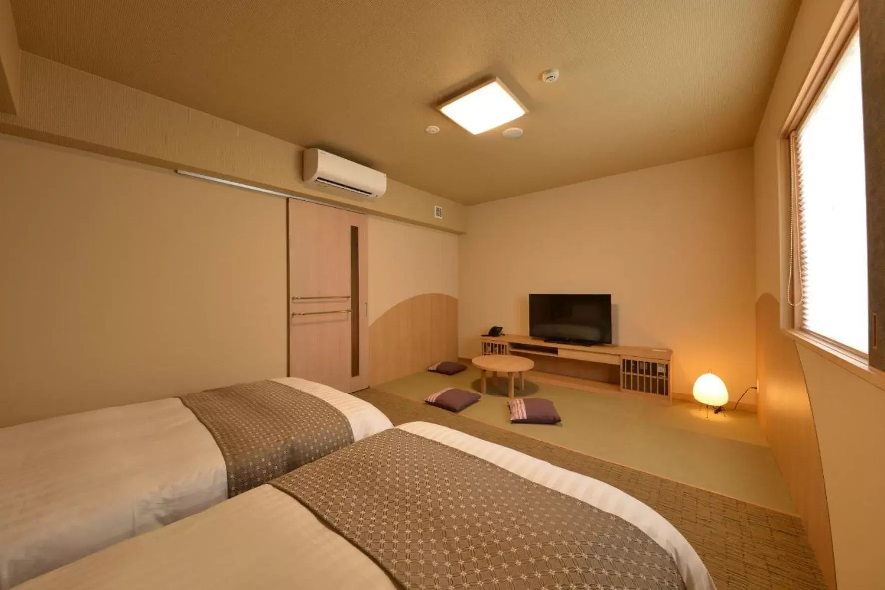 Bed in Dormy Inn Takamatsu Chuo Koenmae Natural Hot Spring