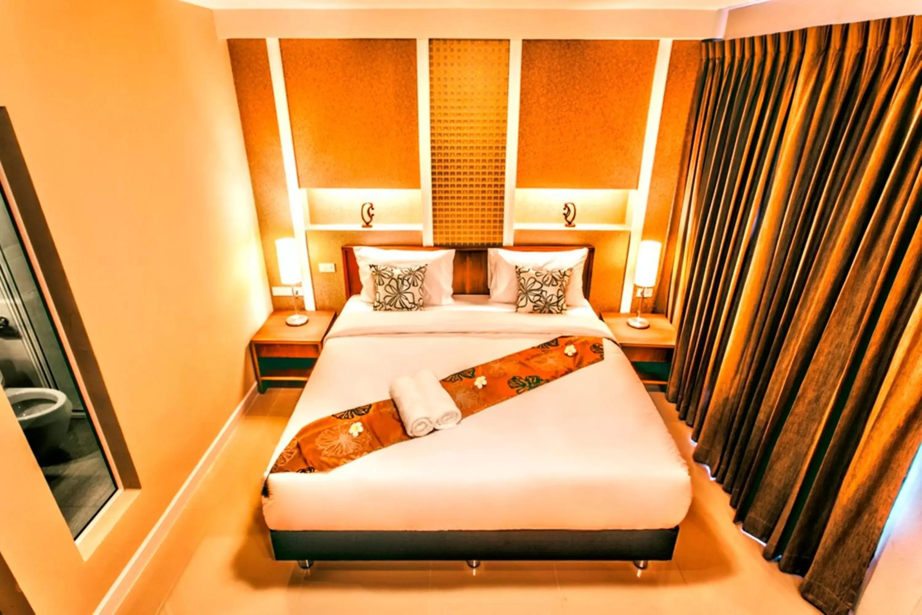 Photo of the whole room, Bed in The Aim Sathorn Hotel