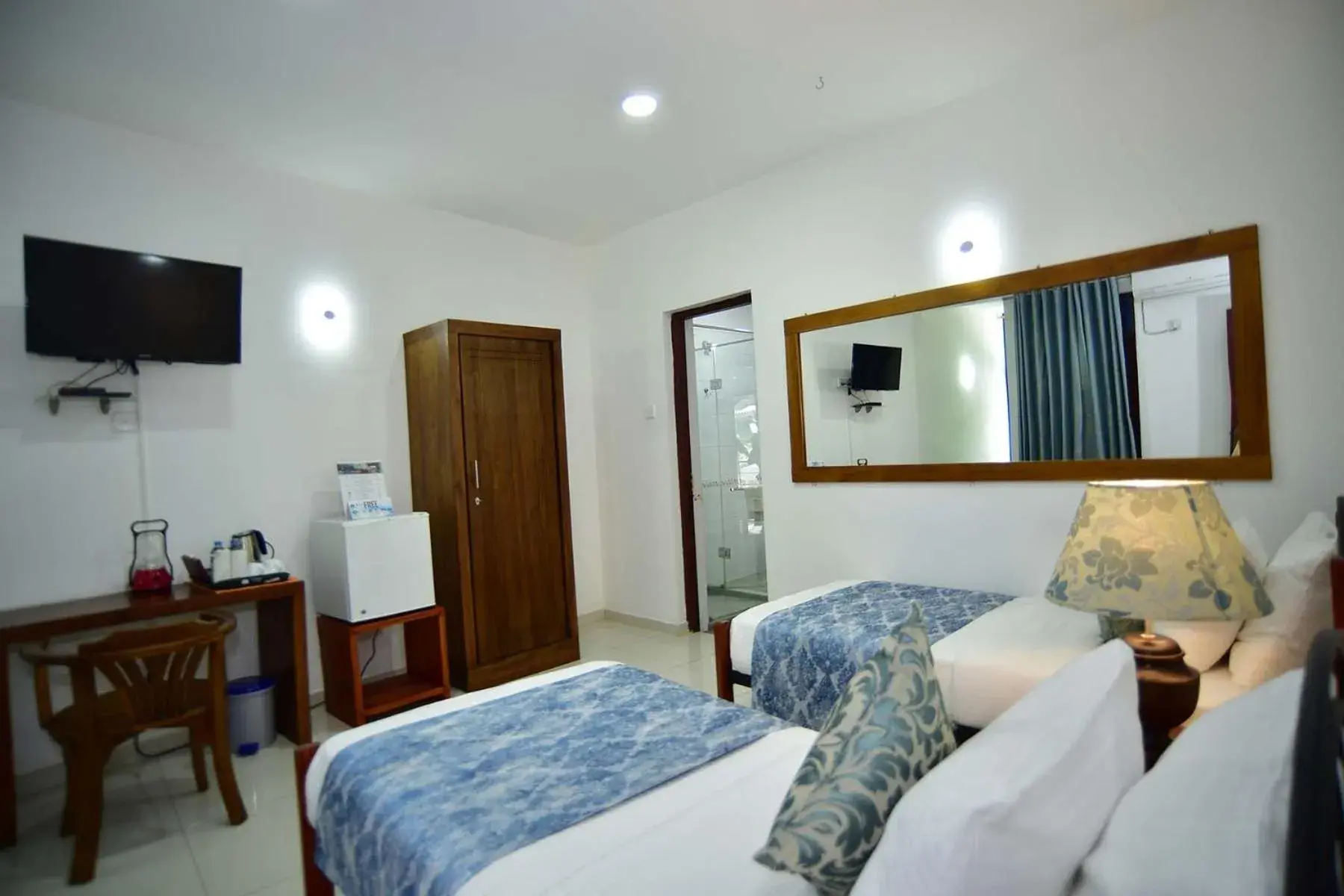 Bed, TV/Entertainment Center in Colombo Villa at Cambridge Place