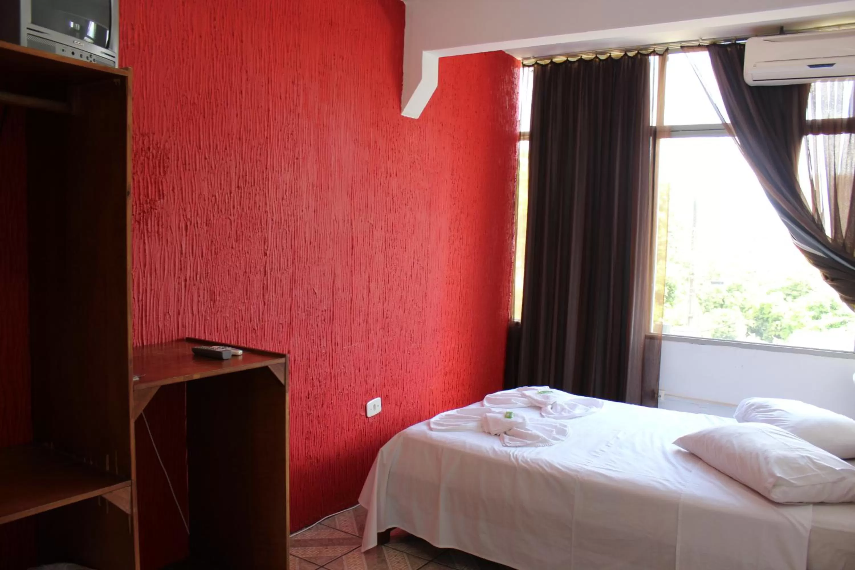 Bed in Pousada Oliveira