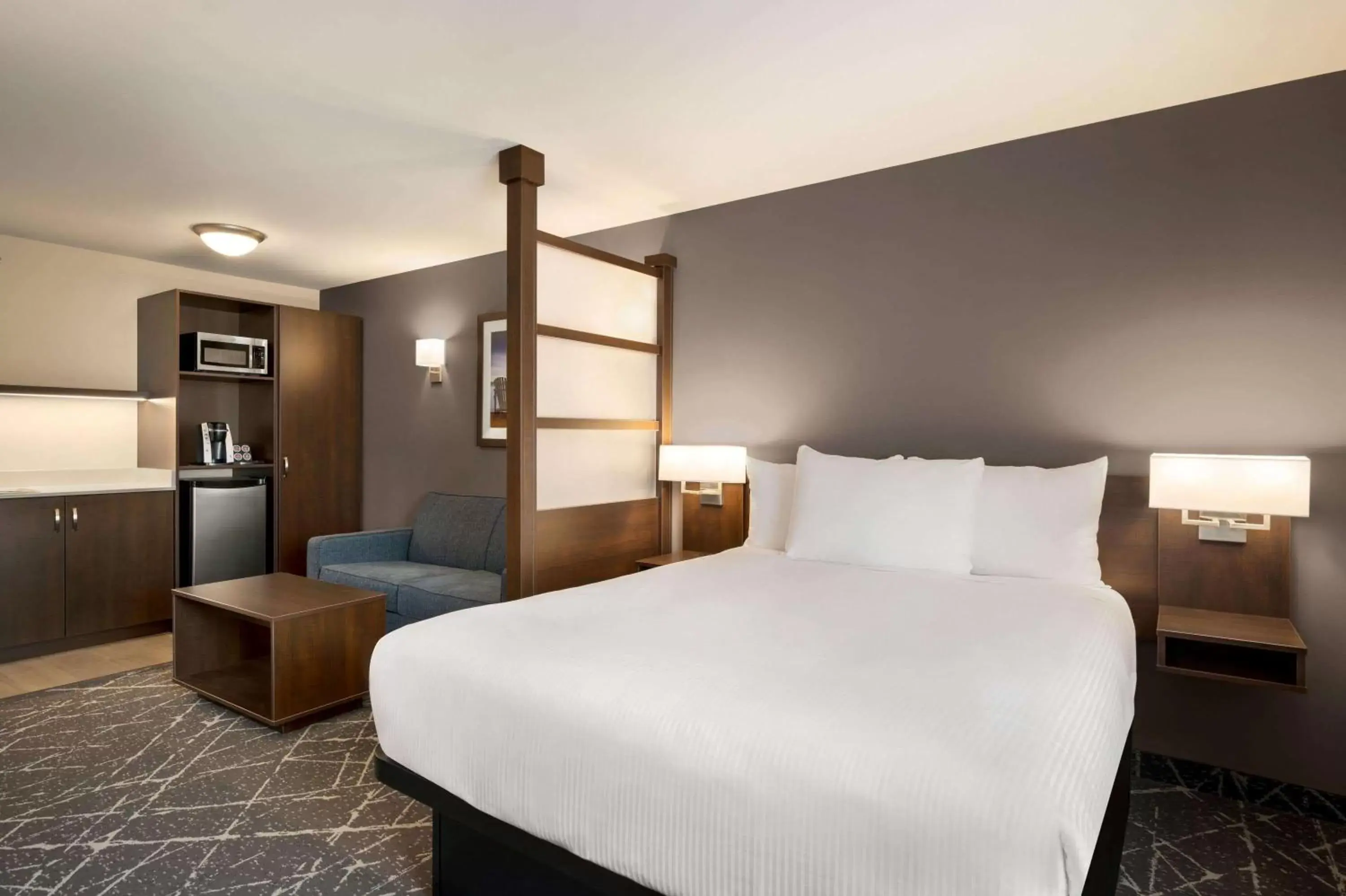 Bed in Microtel Inn & Suites by Wyndham Aurora