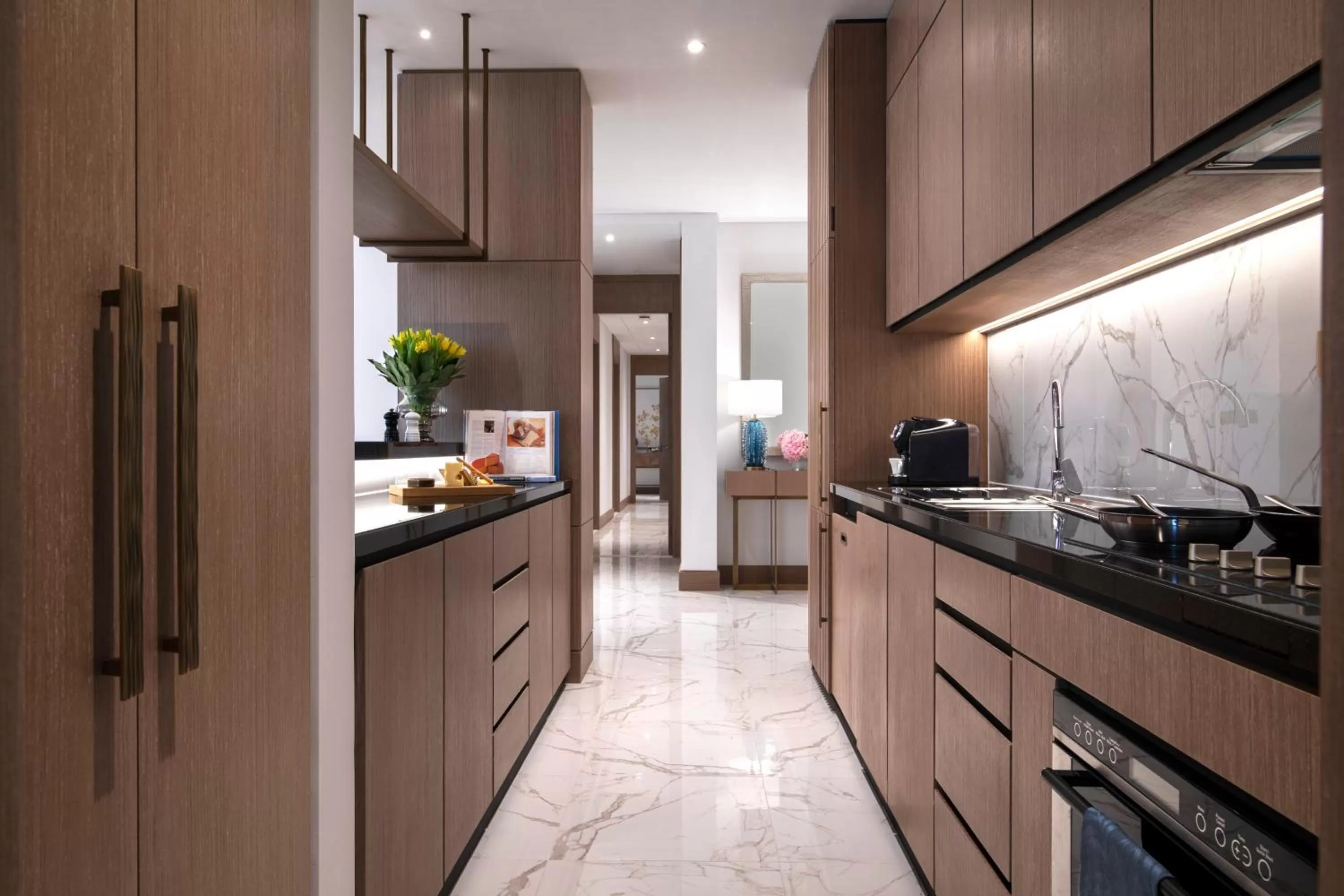Kitchen or kitchenette in Al Jaddaf Rotana Suite Hotel