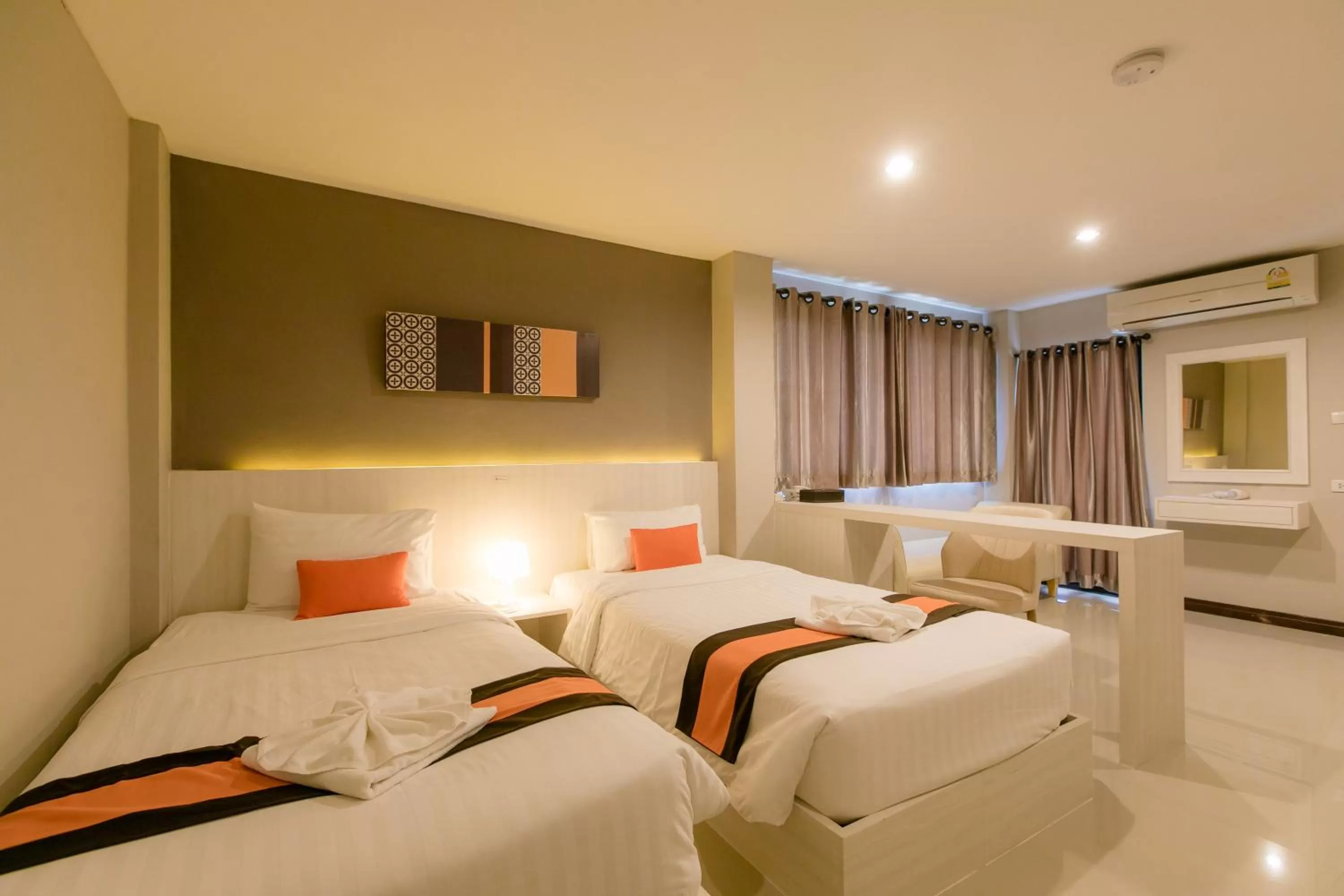 Bed in De Hug Hotel & Residence