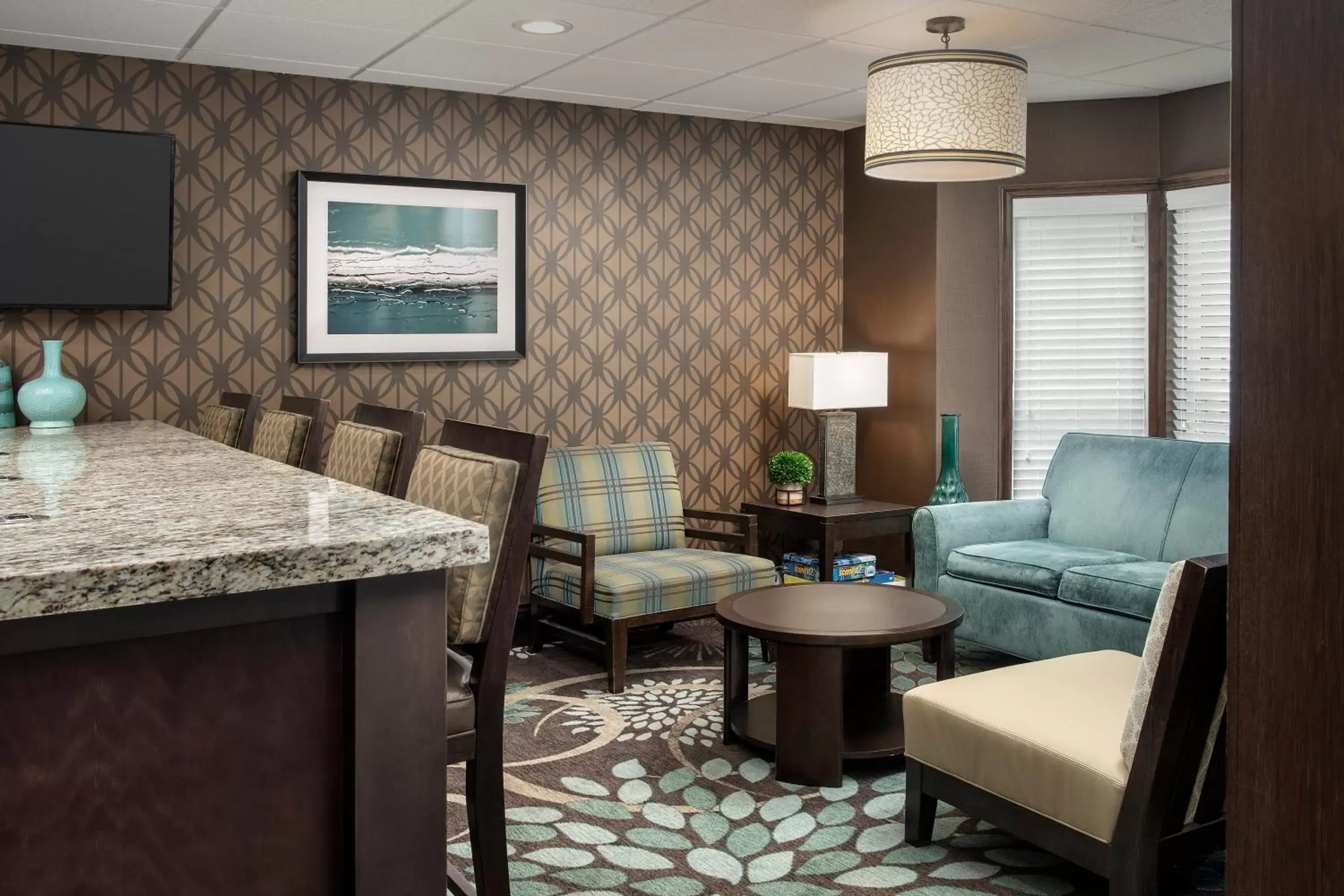 Communal lounge/ TV room in Staybridge Suites Greenville I-85 Woodruff Road, an IHG Hotel