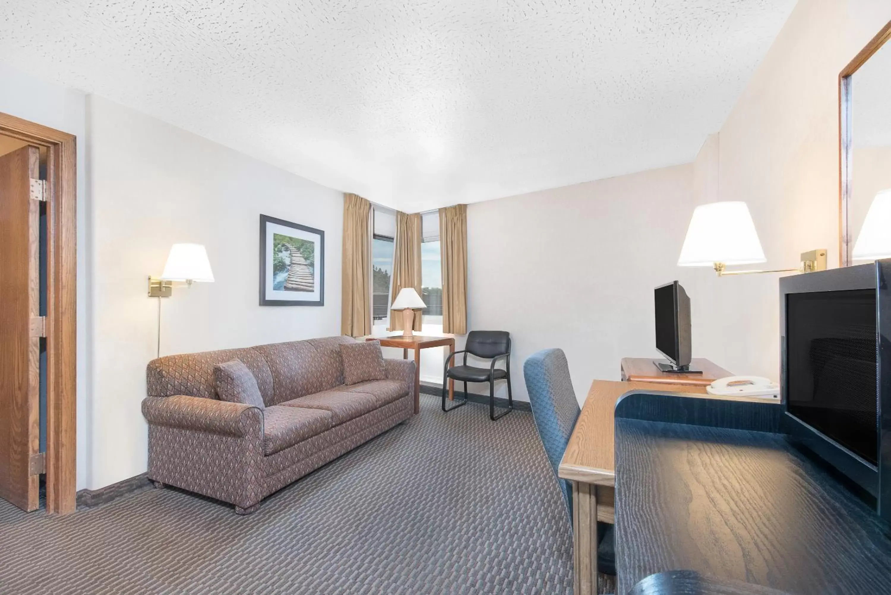 Living room, Seating Area in Days Inn by Wyndham West Rapid City