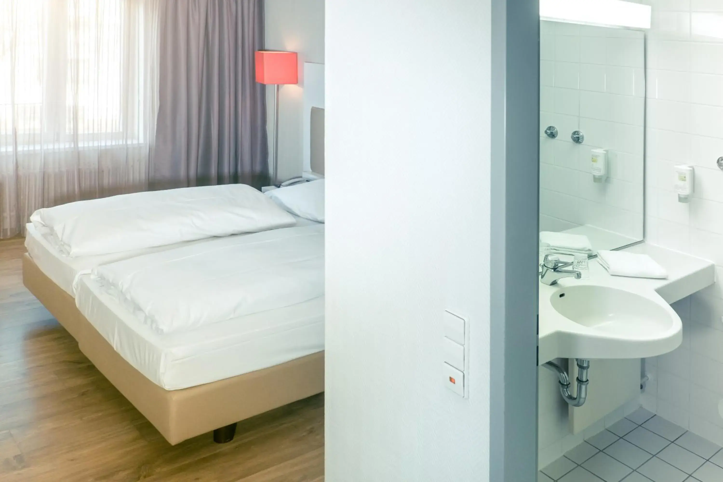 Photo of the whole room, Bathroom in Hotel Stuttgart Sindelfingen City by Tulip Inn