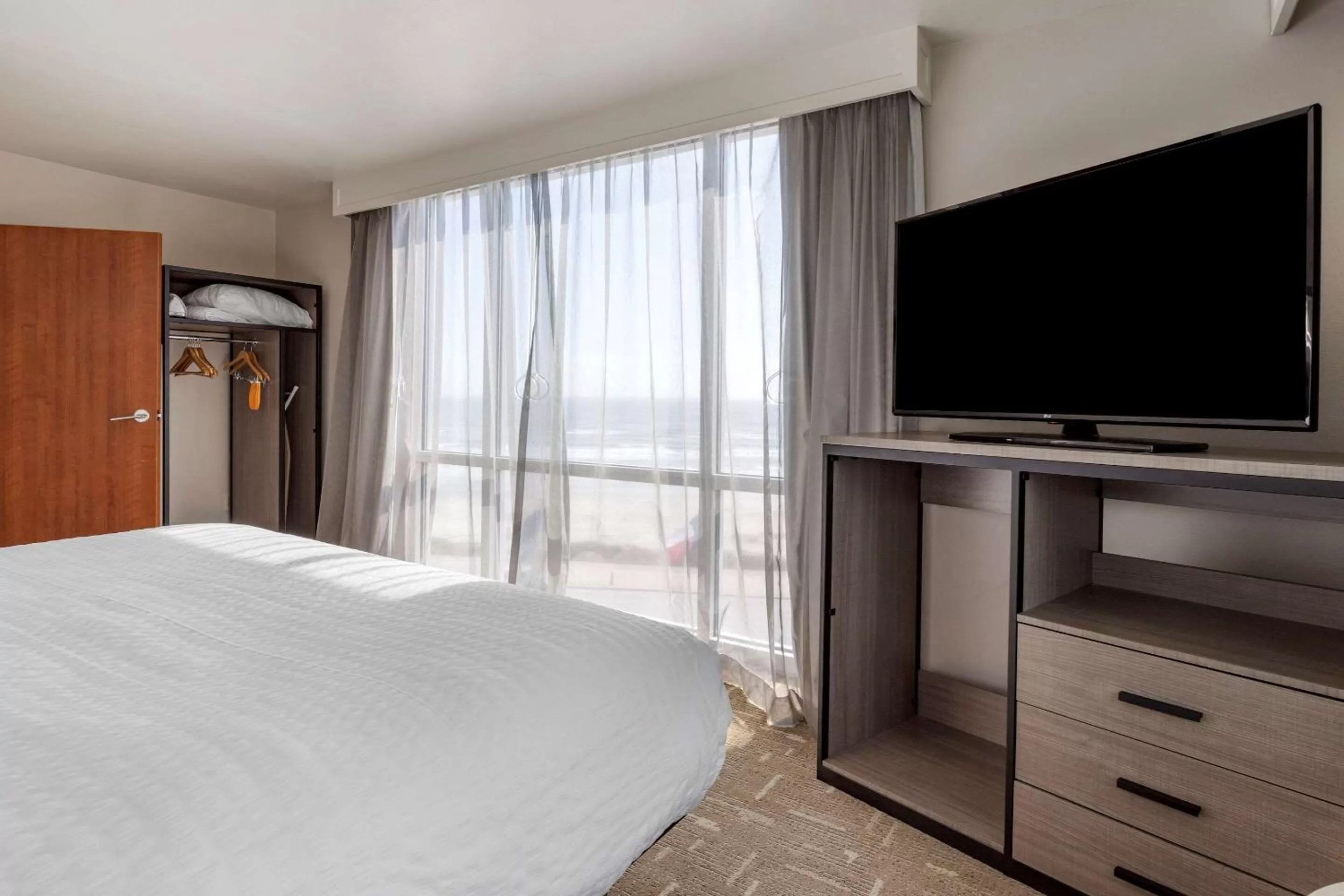 Bedroom, TV/Entertainment Center in Clarion Pointe Galveston Seawall
