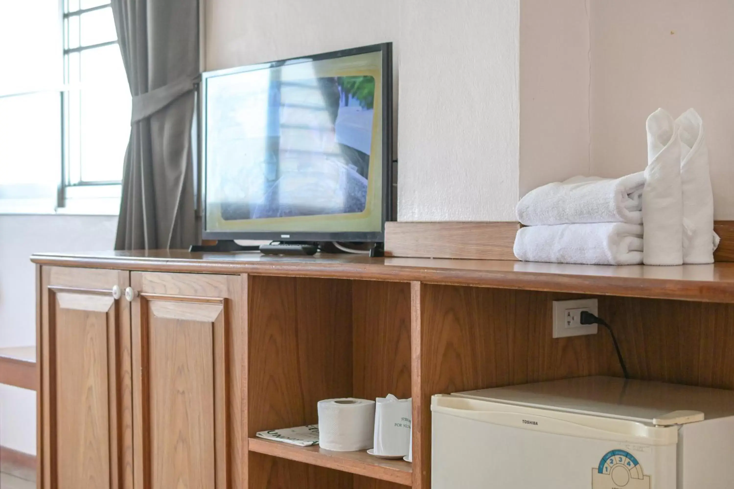 TV and multimedia, TV/Entertainment Center in Rattana Park Hotel