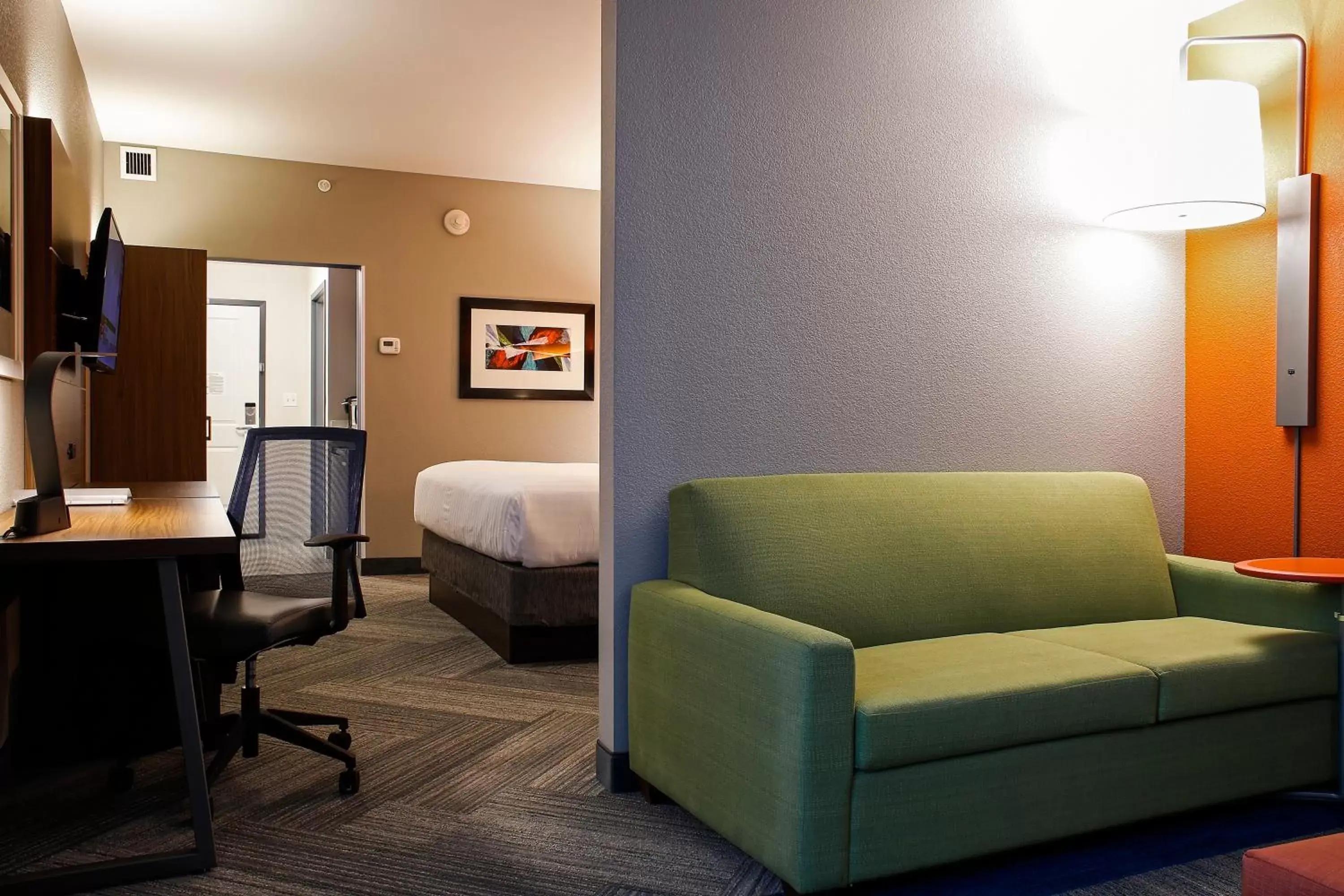 Bedroom, Seating Area in Holiday Inn Express & Suites Downtown Louisville, an IHG Hotel