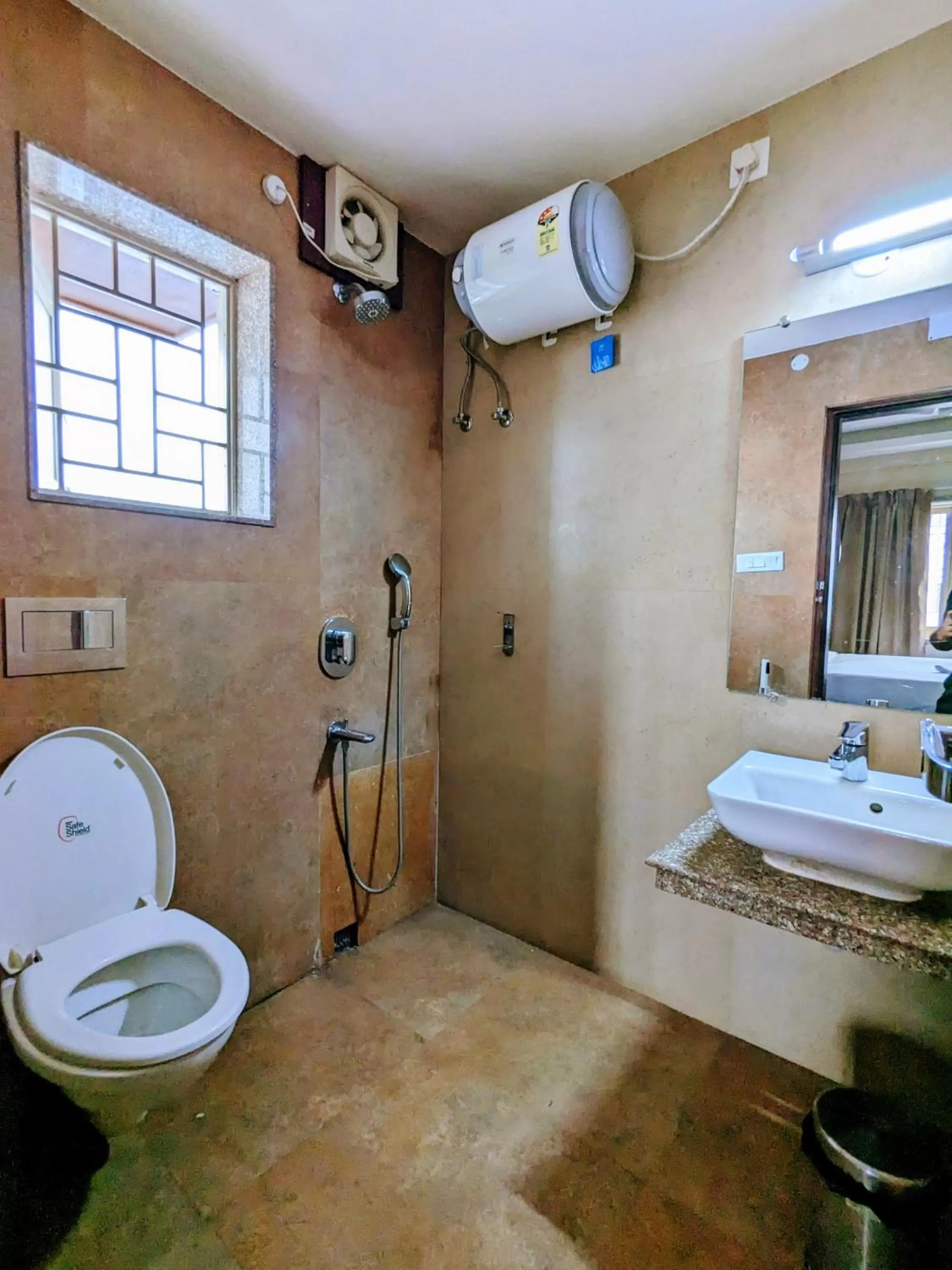 Shower in The Aster Enclave Hotel