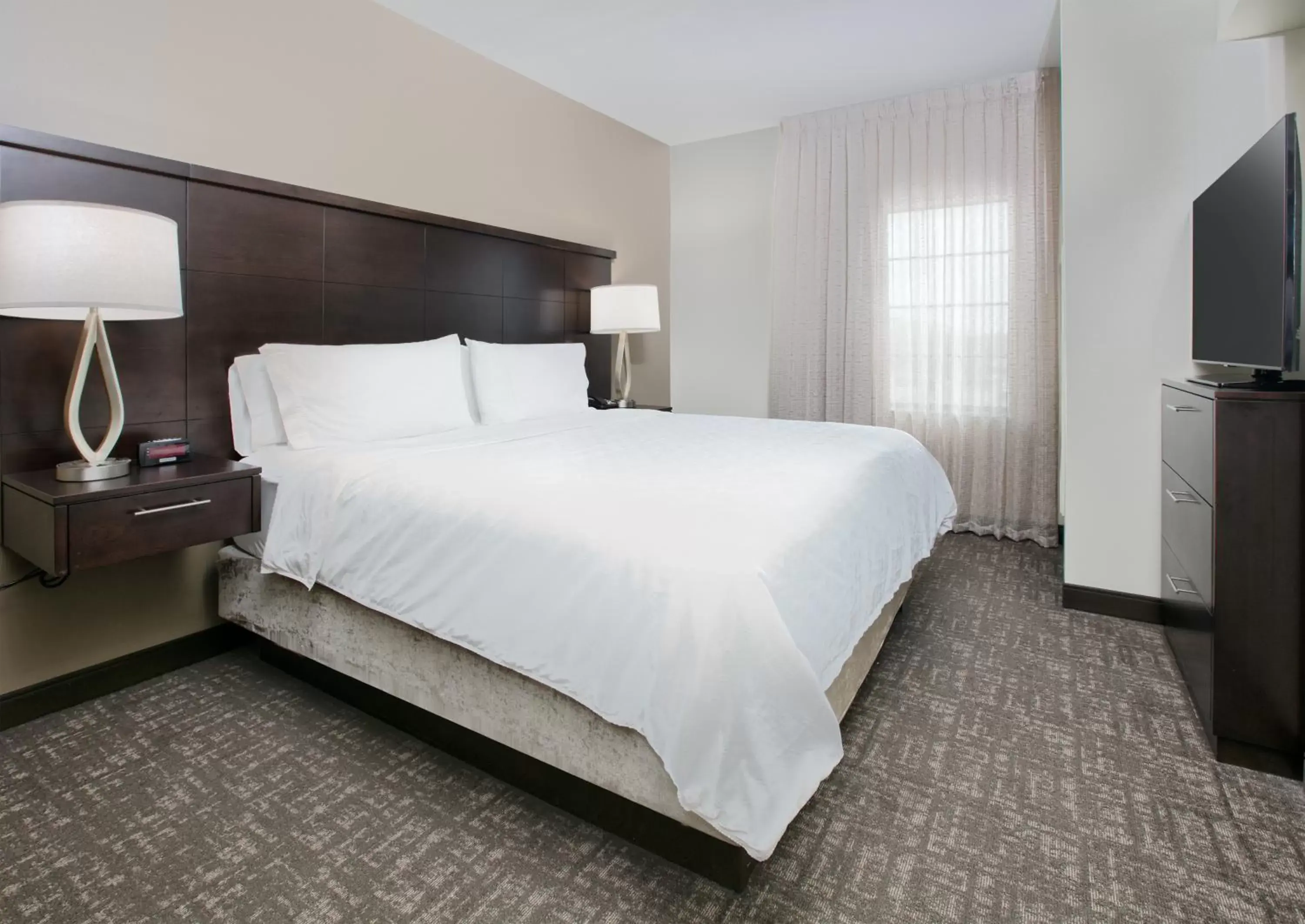 Bed in Staybridge Suites Plano - Richardson Area, an IHG Hotel