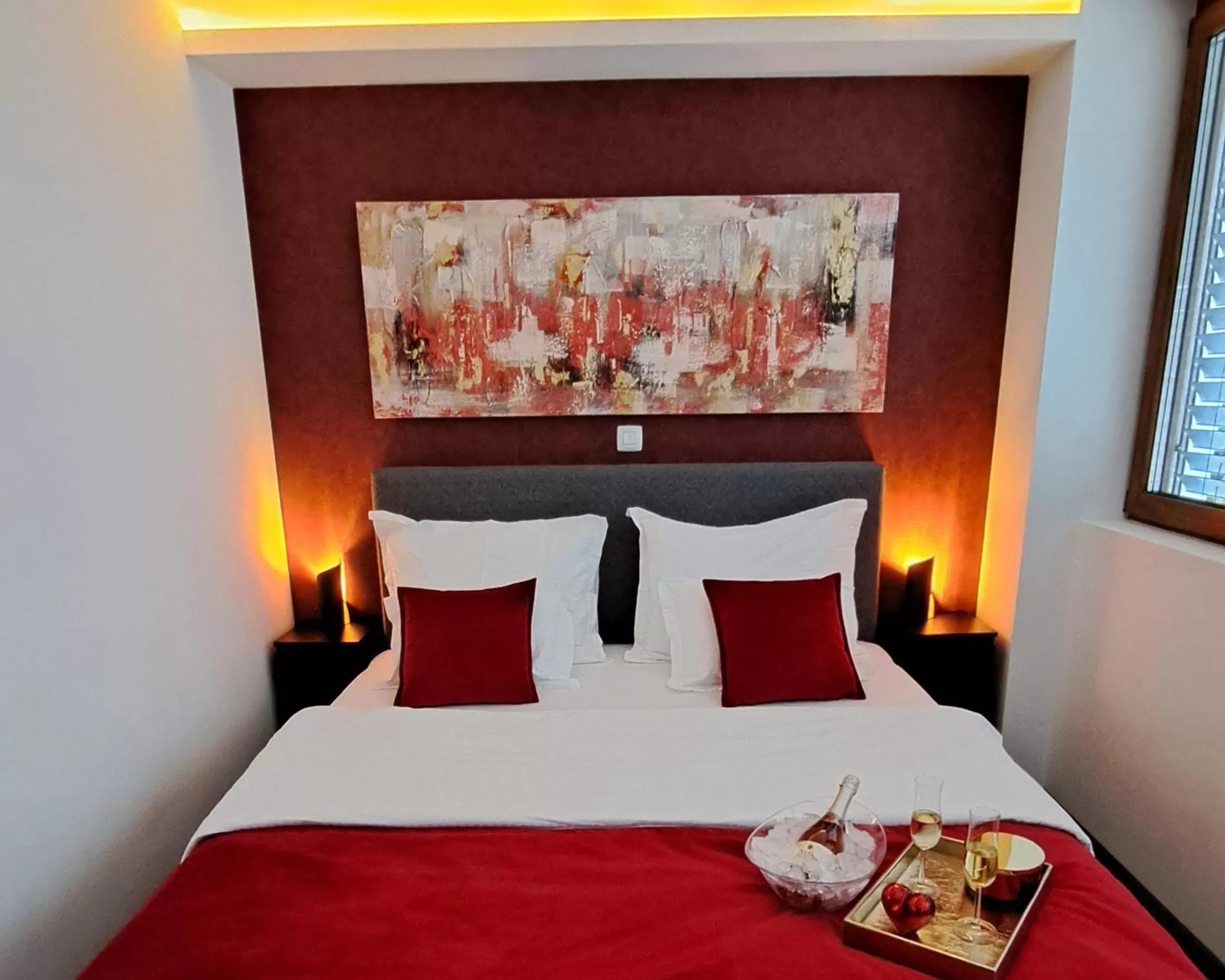 Bed in Arcobaleno Apartments & Rooms
