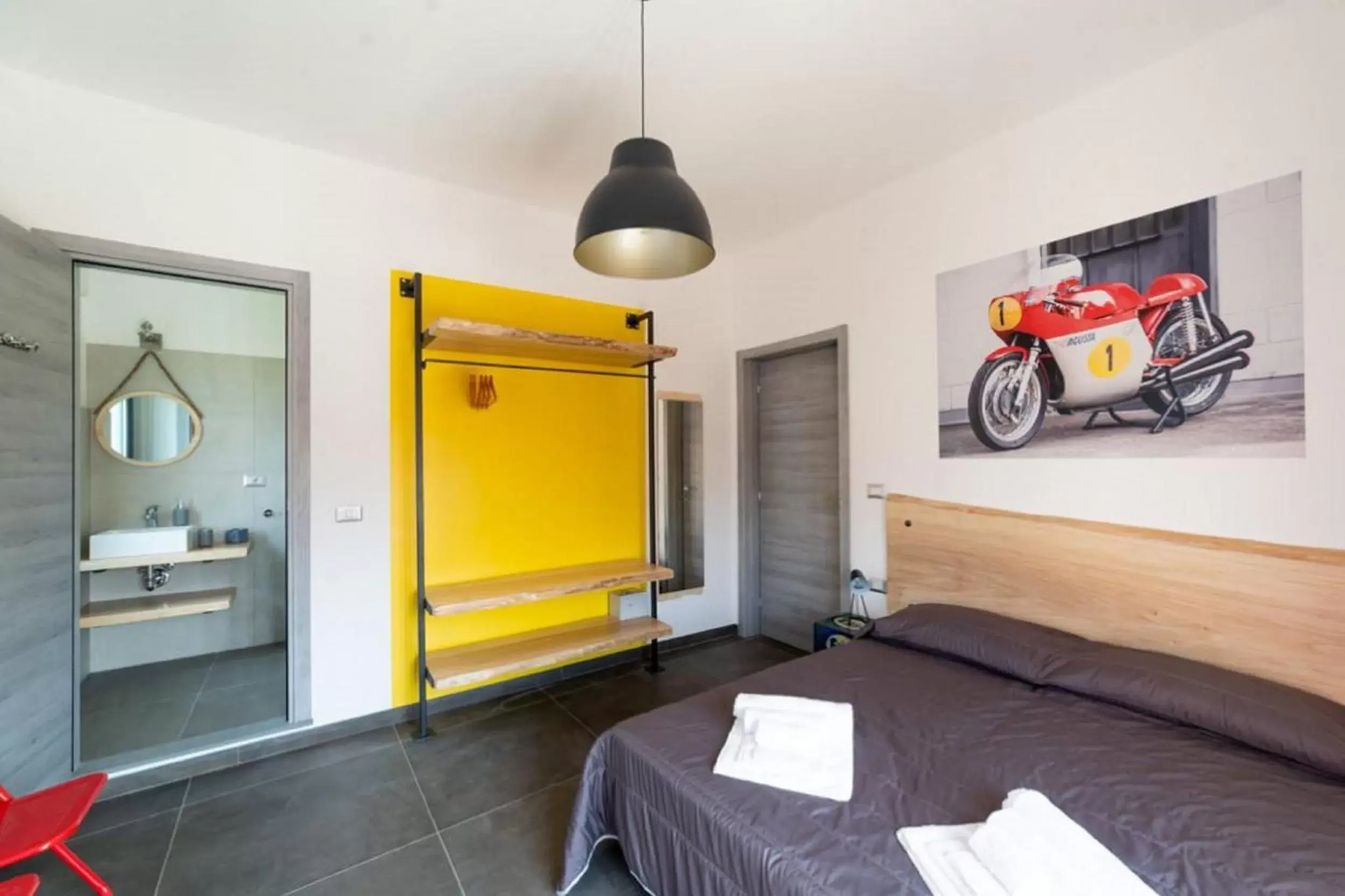 Photo of the whole room, Bed in Italian Piston House Sport Moto Rent