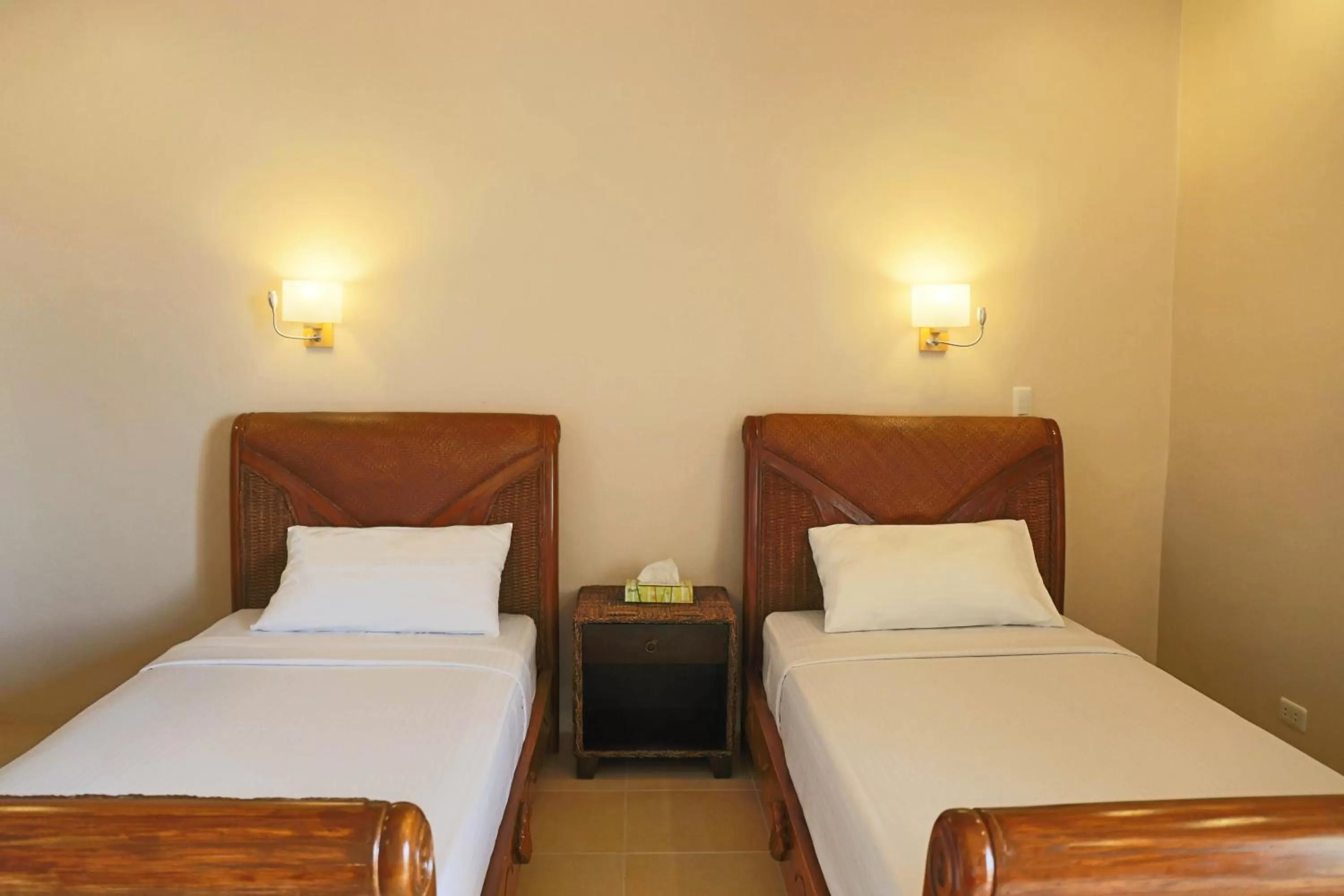 Bed in Turtle Bay Dive Resort