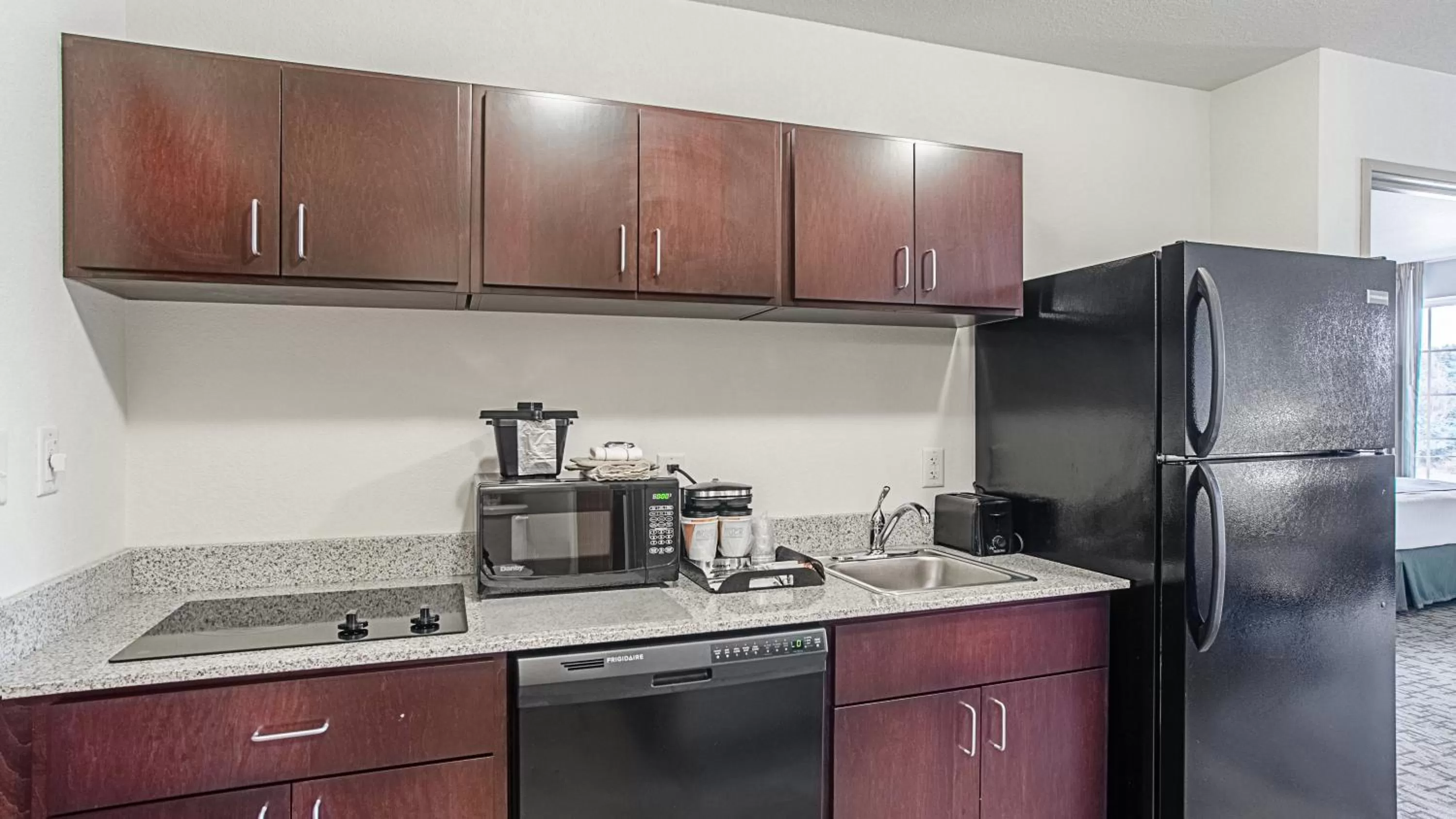 Kitchen or kitchenette in Cobblestone Hotel & Suites - Torrington