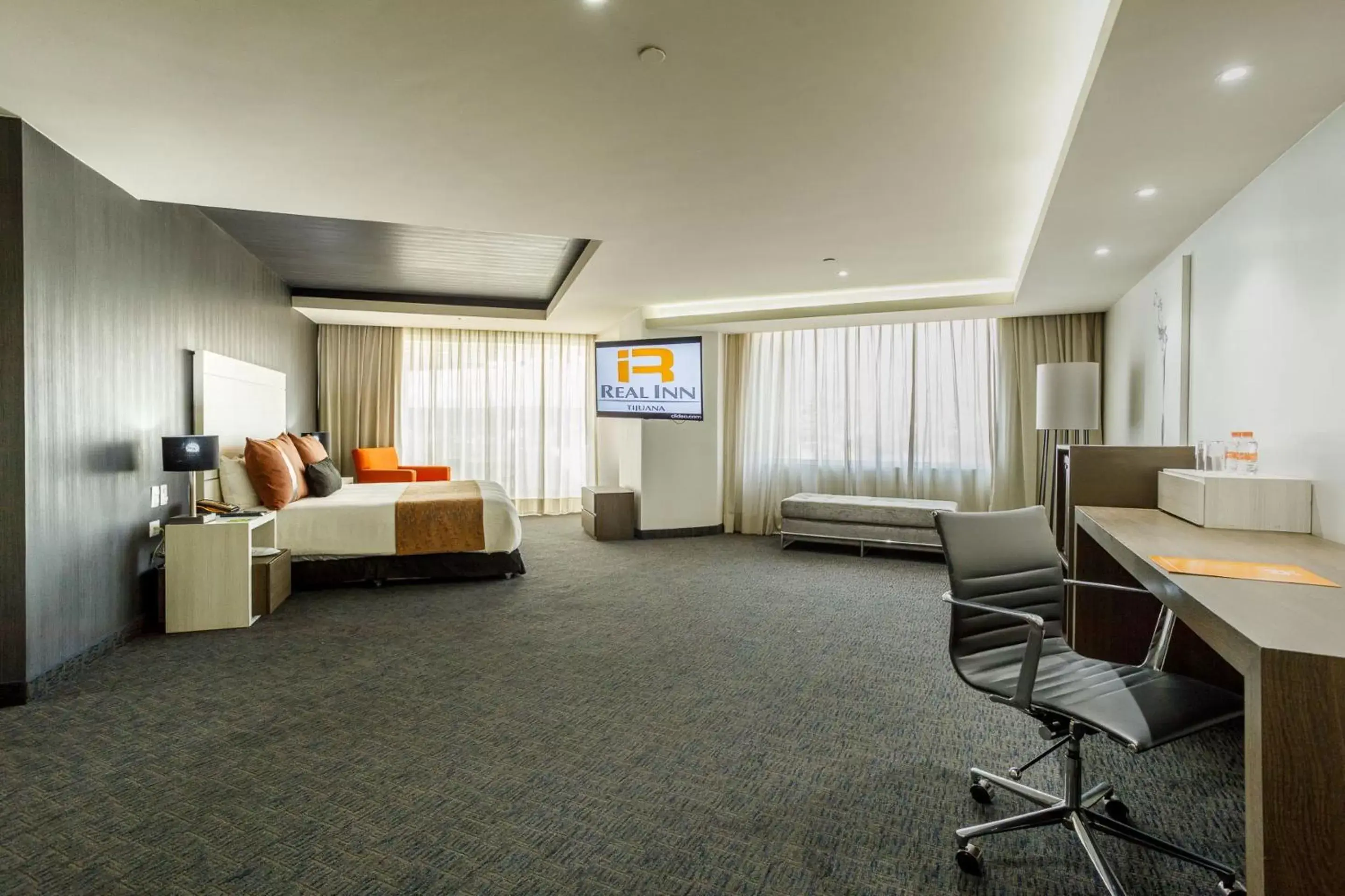 Photo of the whole room, Seating Area in Real Inn Tijuana by Camino Real Hotels