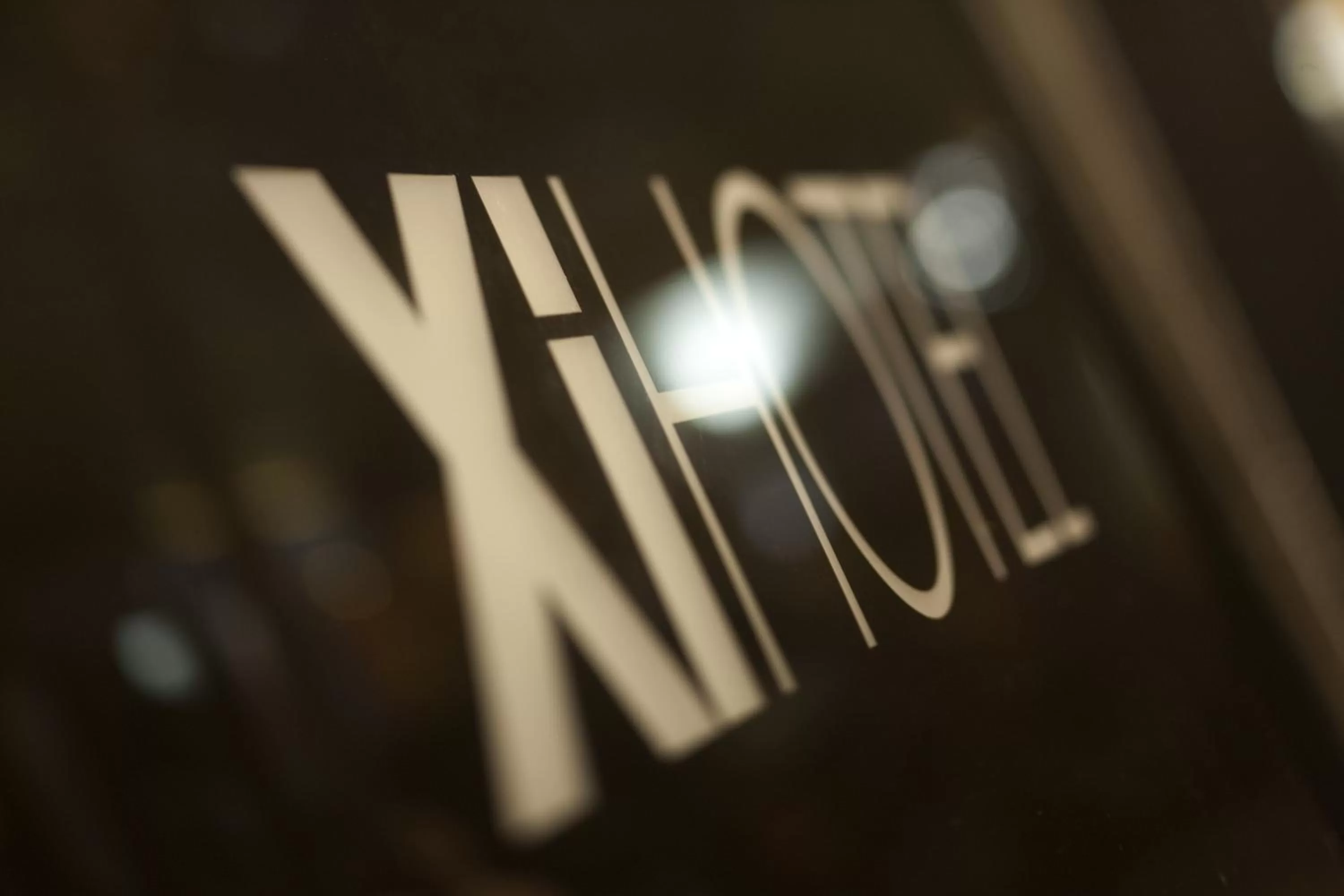 Property logo or sign in Xi Hotel