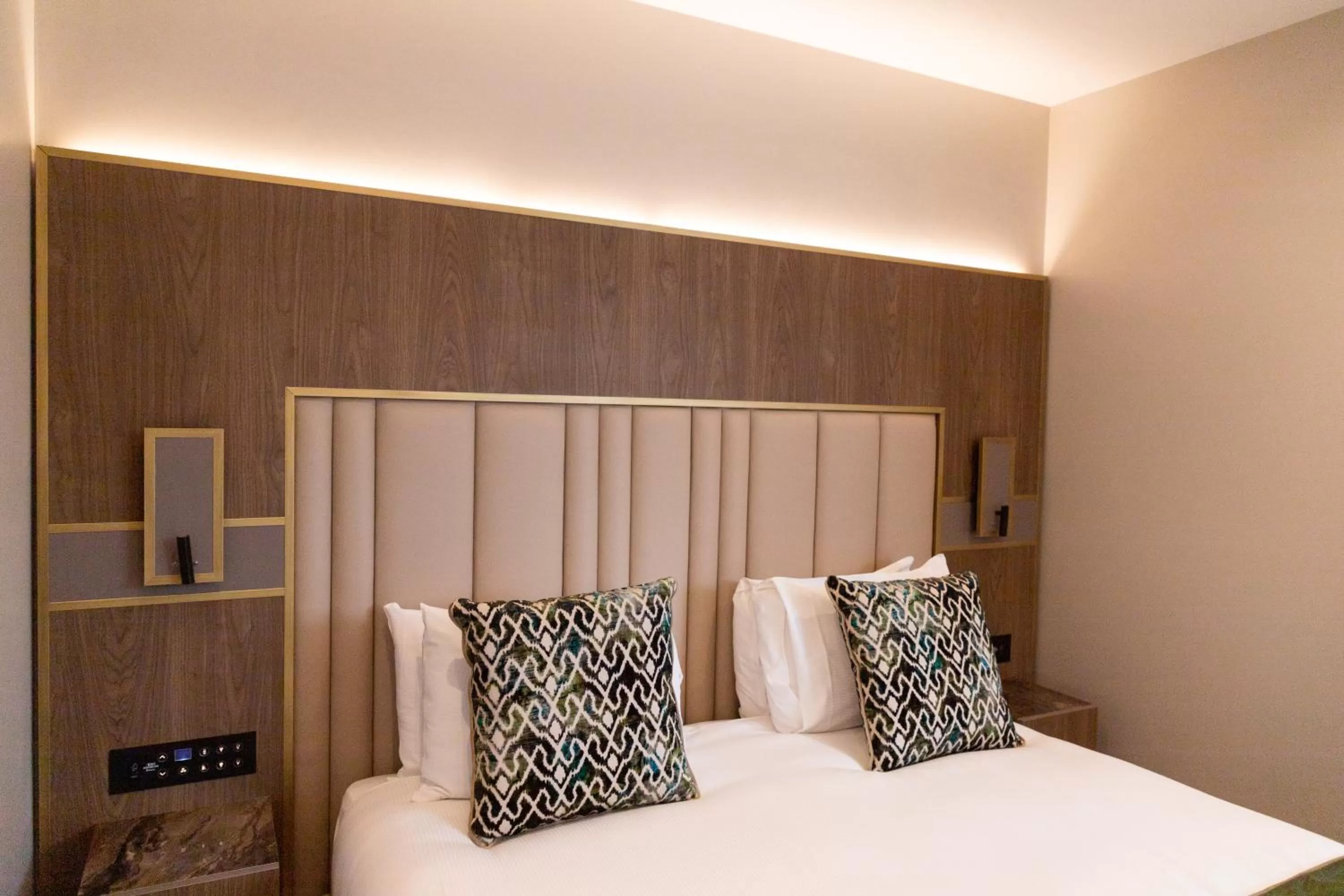 Bed in Merit Kensington Hotel