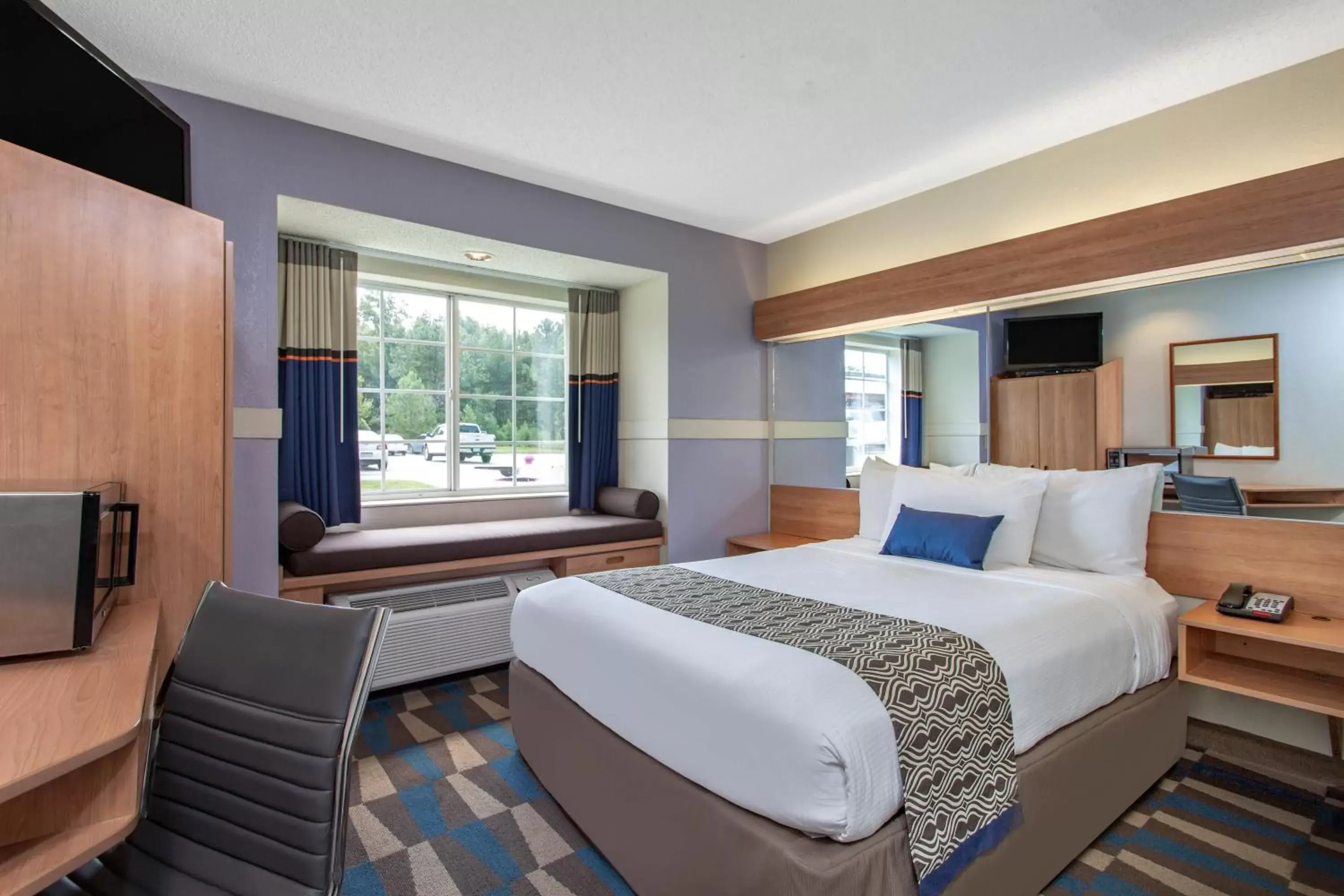 Bed in Microtel Inn & Suites by Wyndham Lillington/Campbell University Bed in Microtel Inn & Suites by Wyndham Lillington/Campbell University