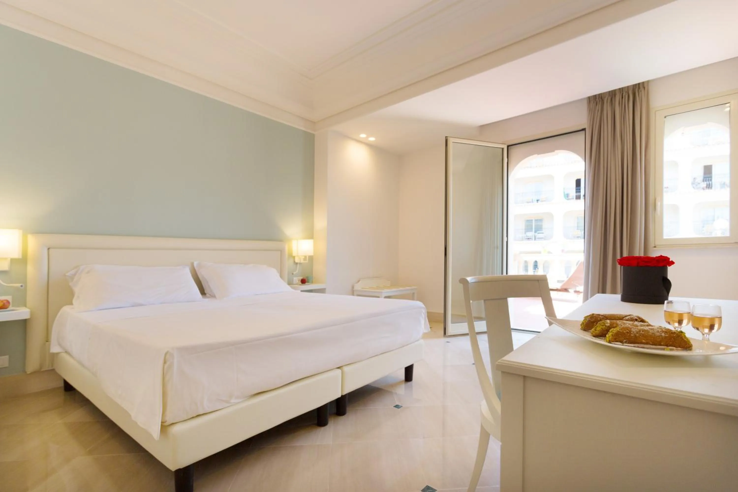 Bed in Hellenia Yachting Hotel & SPA