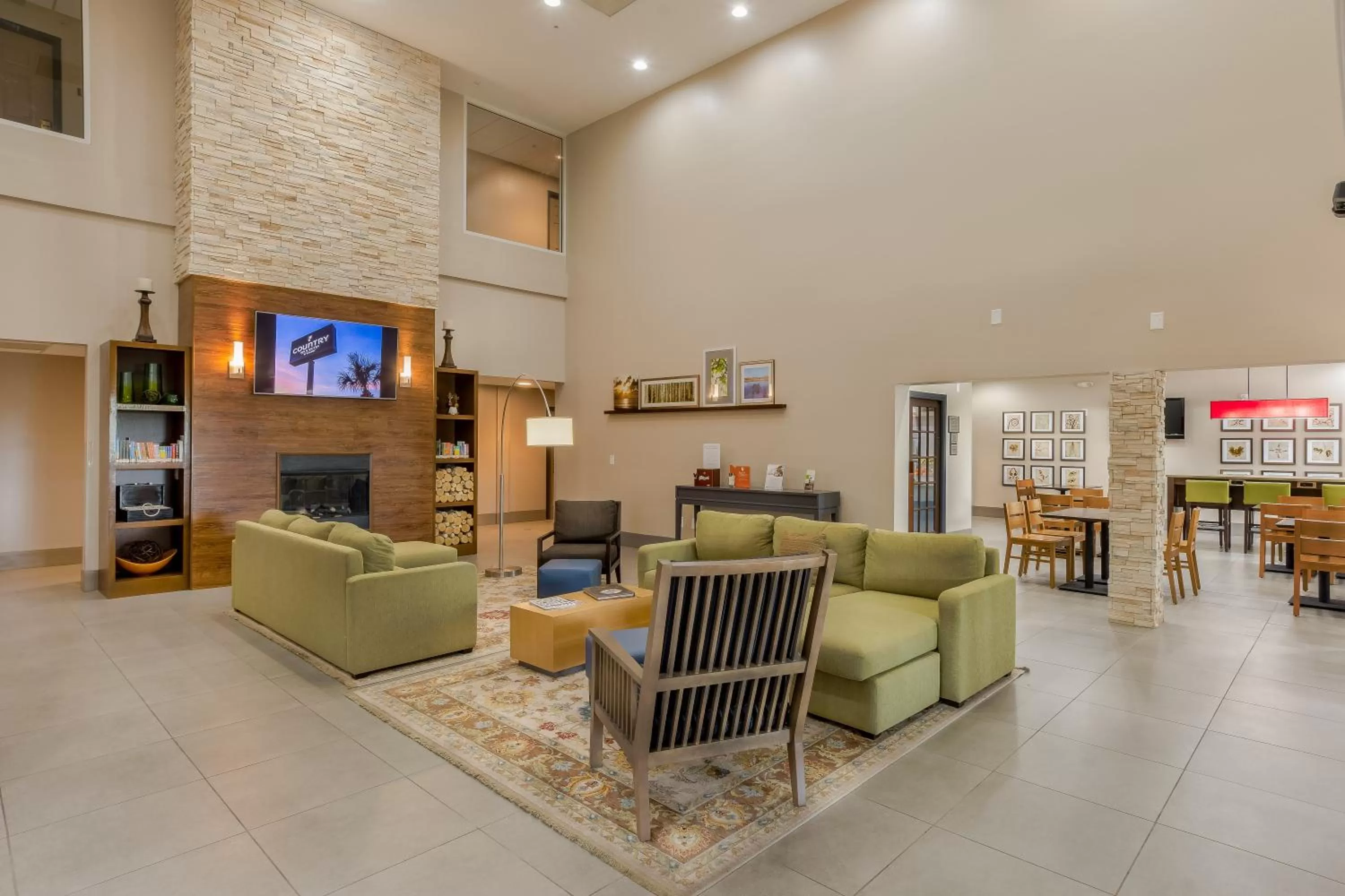 Communal lounge/ TV room in Country Inn & Suites by Radisson, St Petersburg - Clearwater, FL