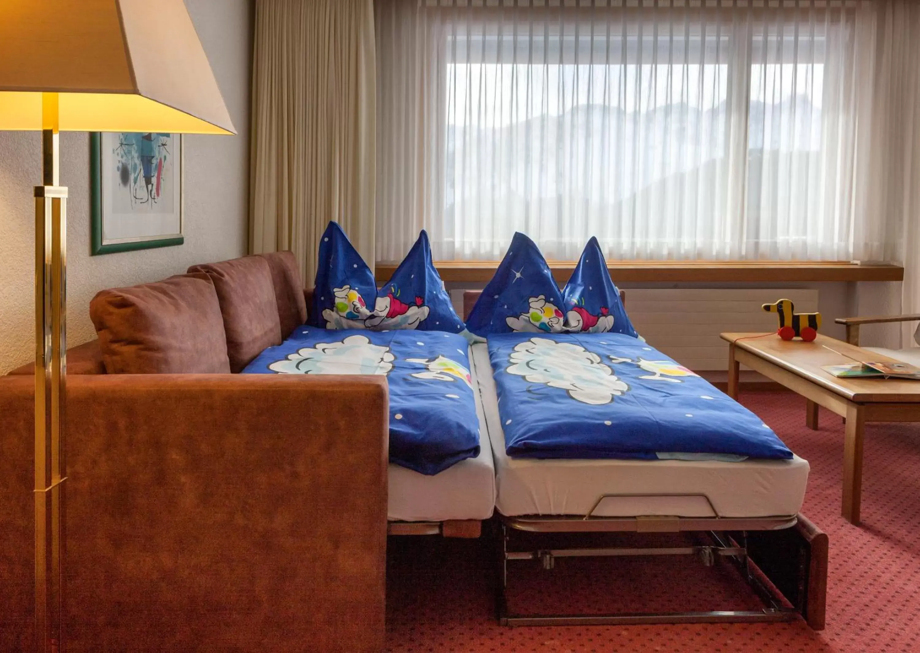 Living room, Bed in Golf- & Sporthotel Hof Maran