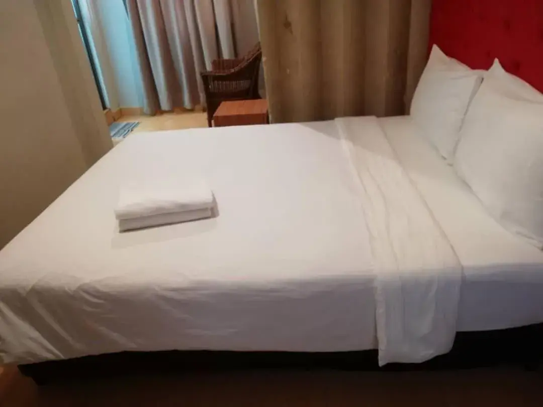 Bed in Suntec Hotel