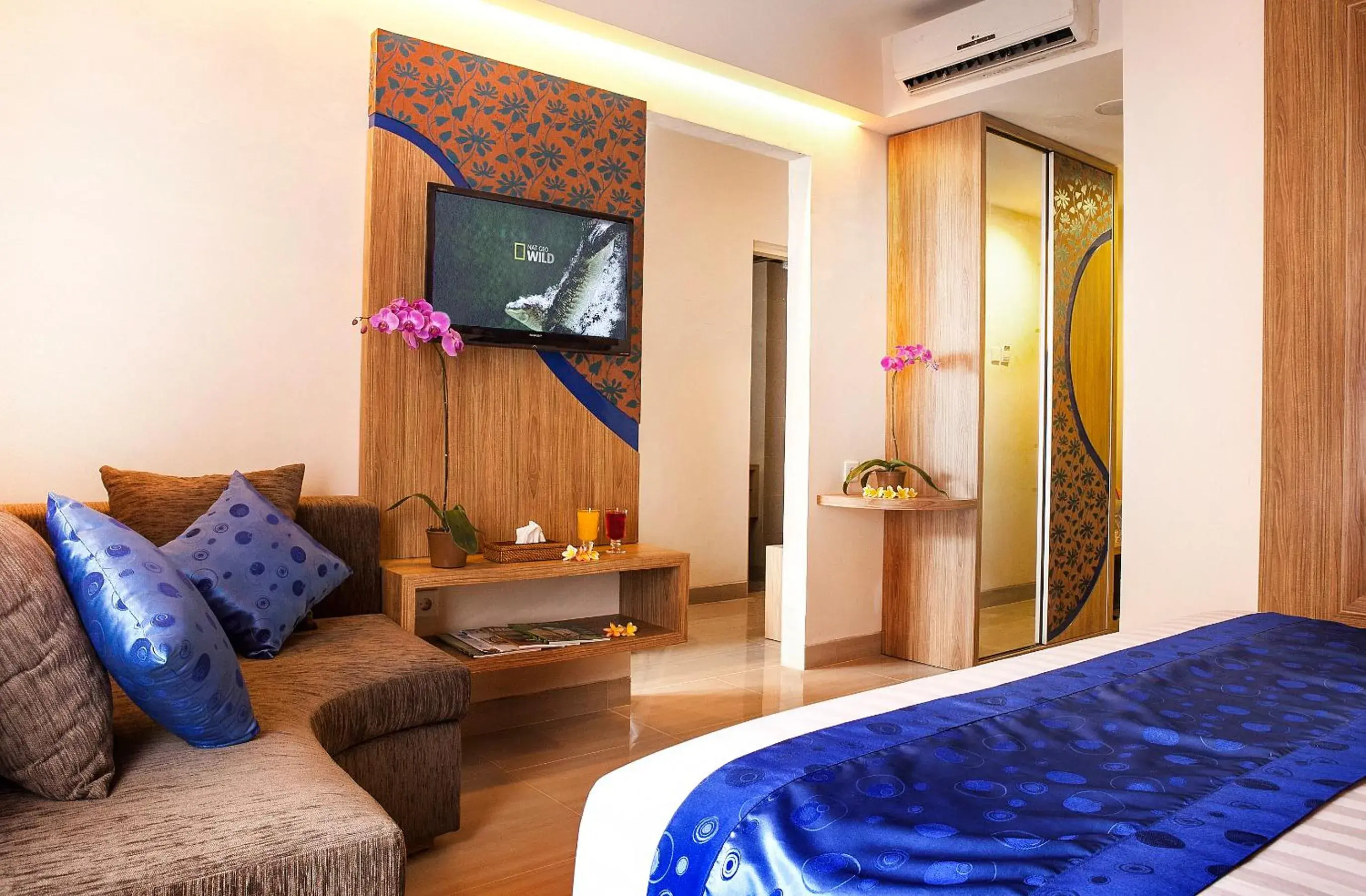 Communal lounge/ TV room, Bed in Natya Hotel Kuta