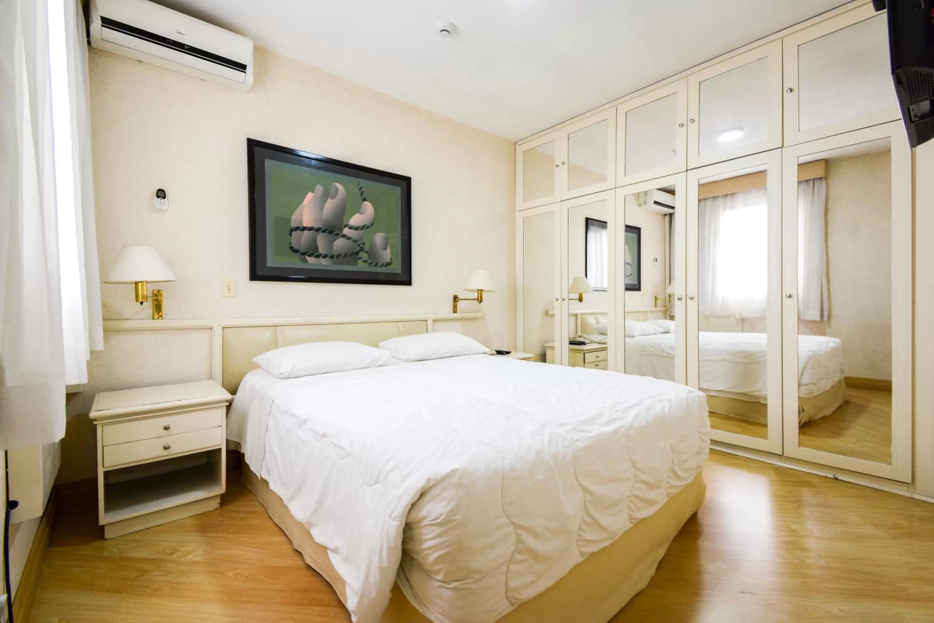 Bed in Wall Street Apartments by BnbHost