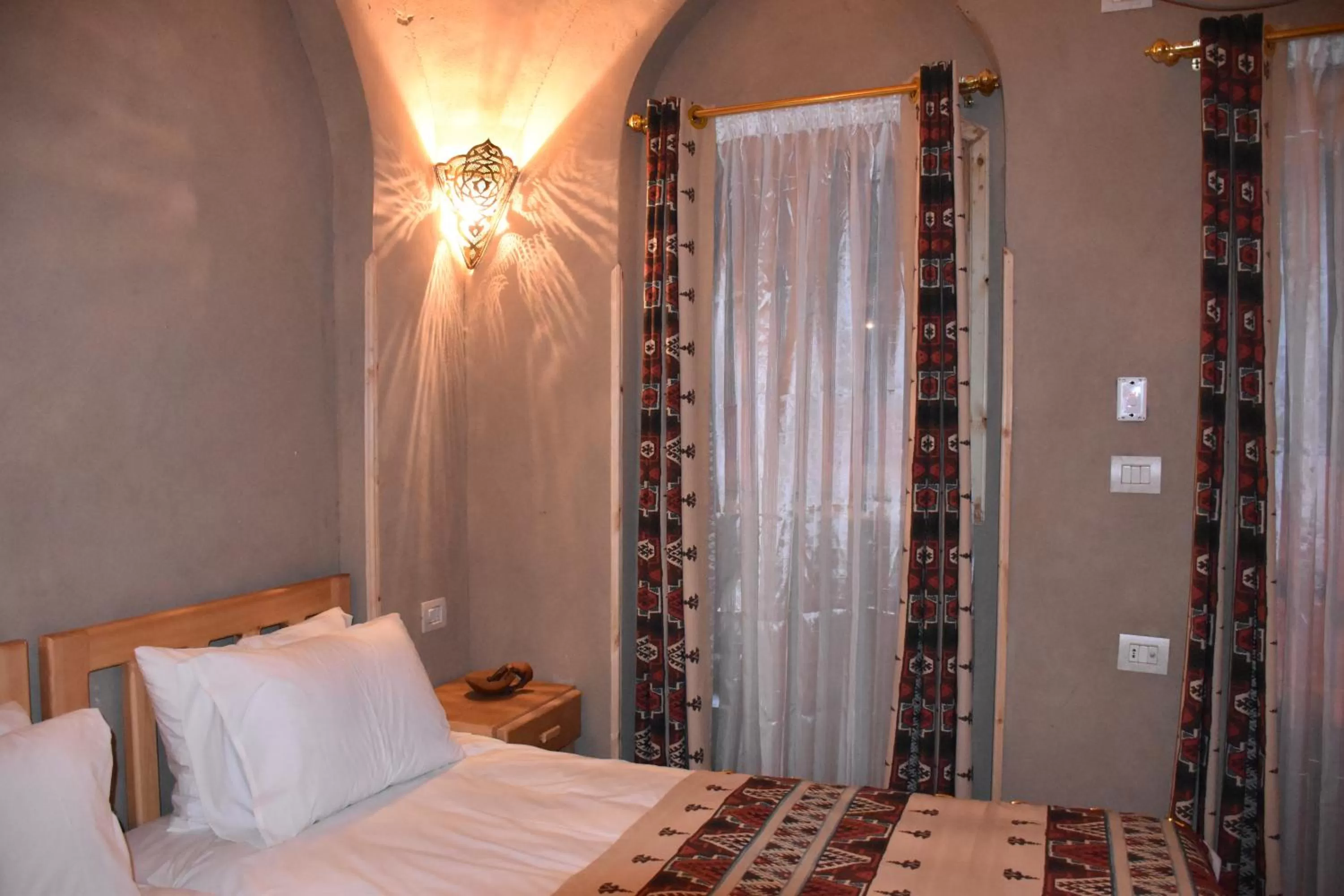 Bed in Embrace Hotel