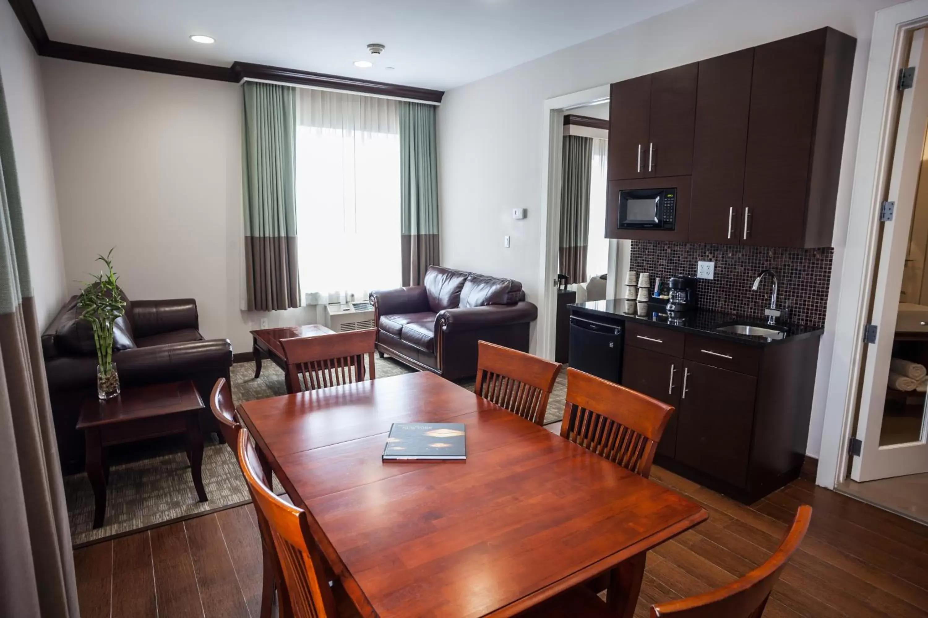 Living room, Dining Area in Condor Hotel Brooklyn