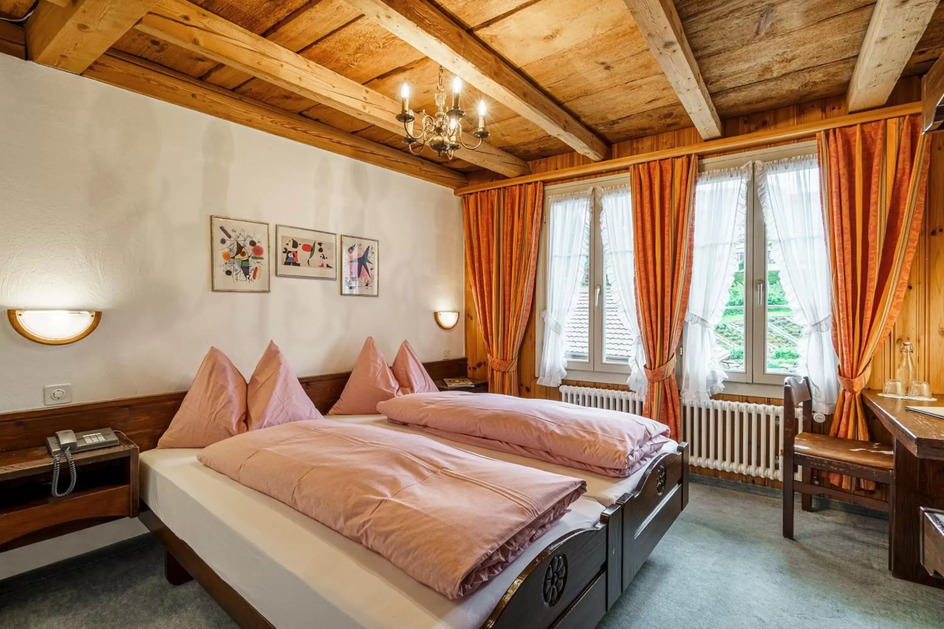 Photo of the whole room, Bed in Alpenblick Hotel & Restaurant Wilderswil by Interlaken