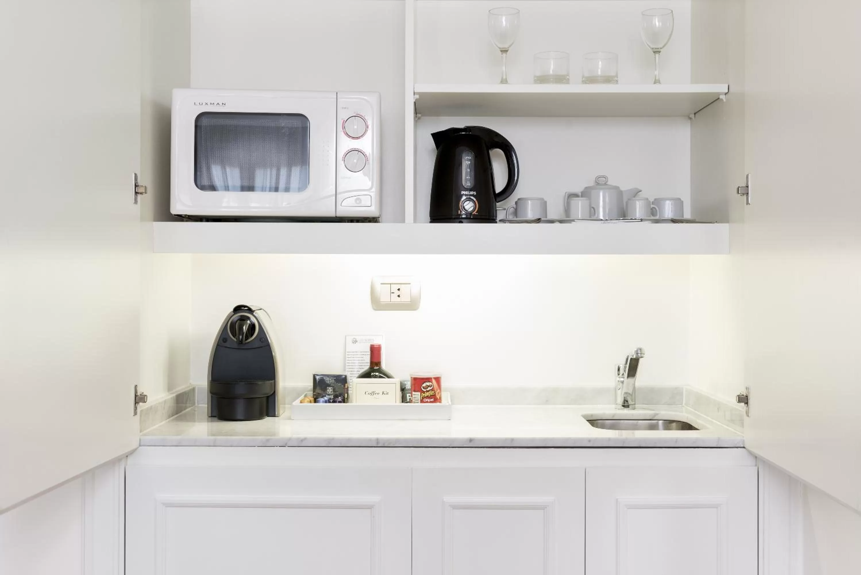 Kitchen or kitchenette in Loi Suites Recoleta Hotel