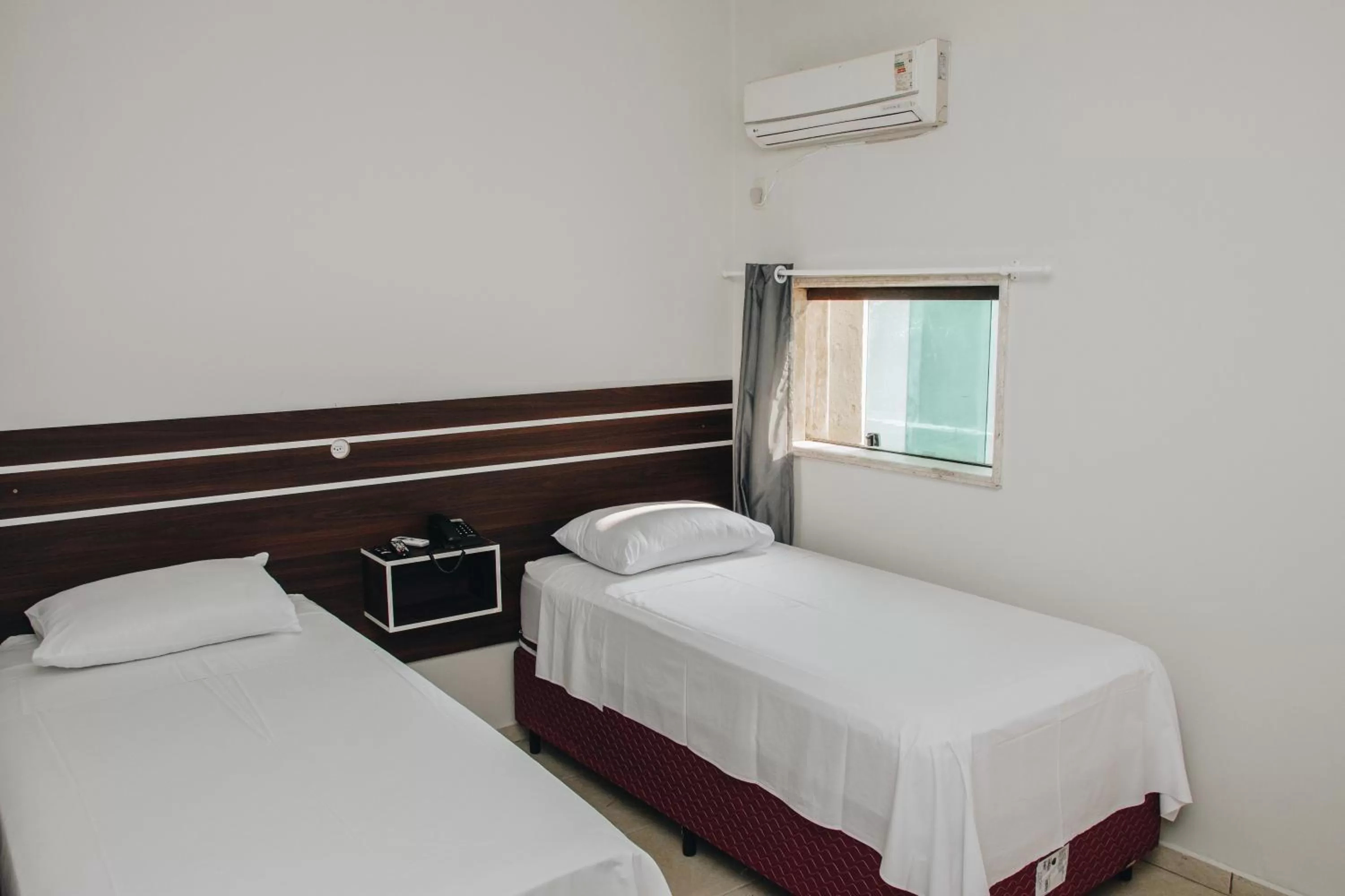 Bed in SAMIR HOTEL COMFORT