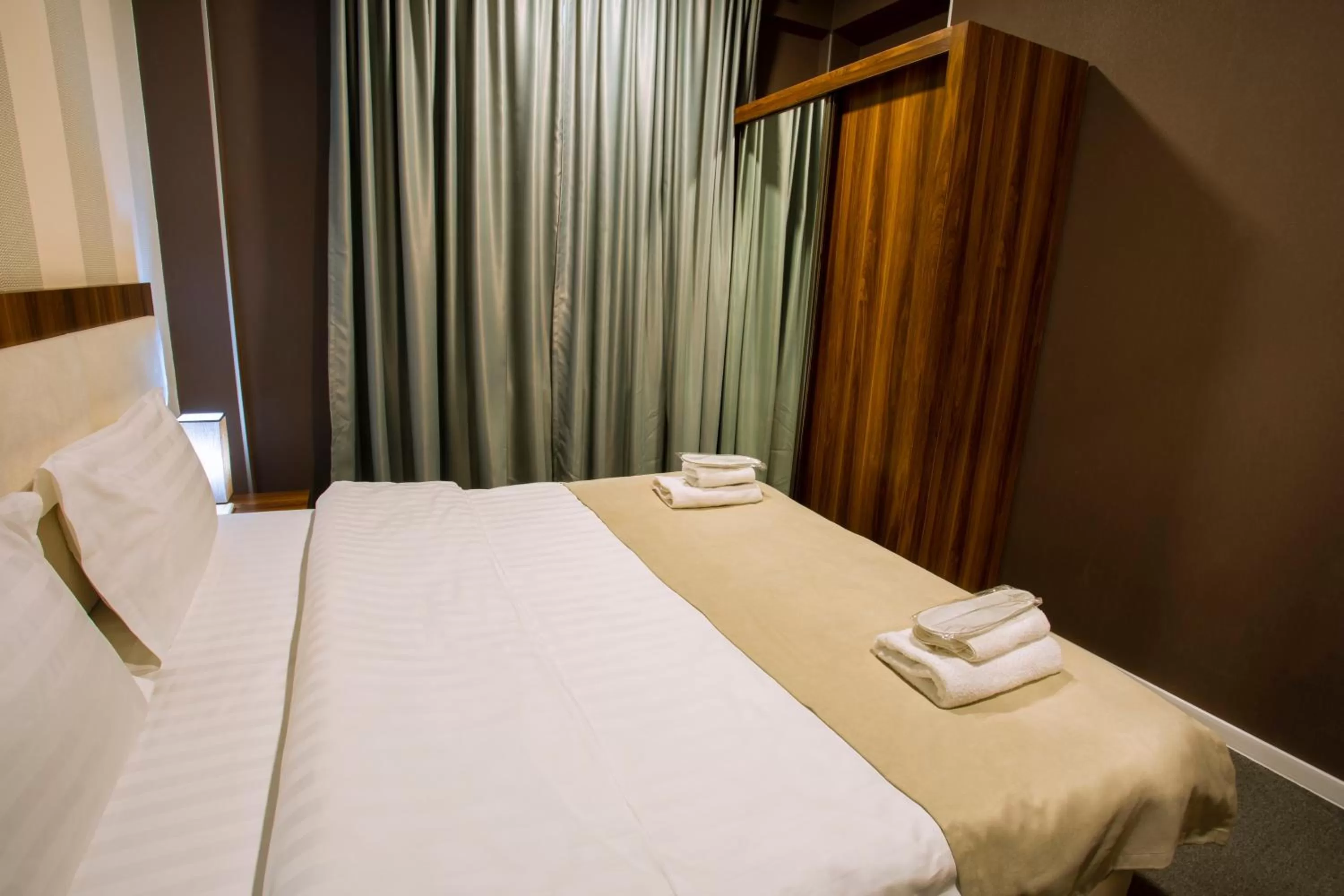 Bed in Apart Hotel West