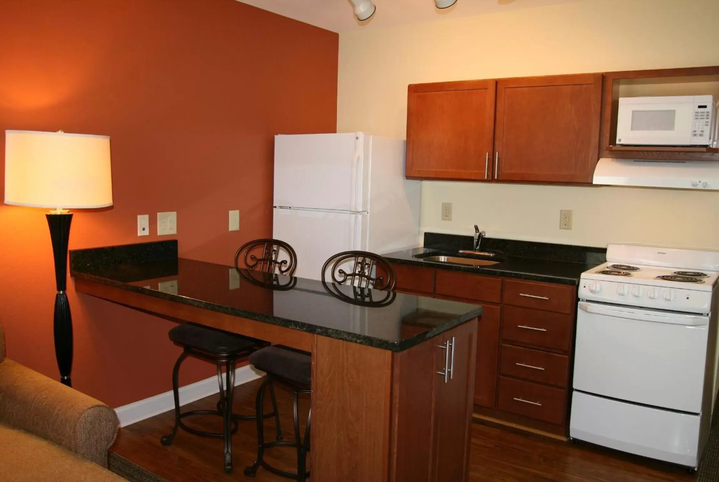 Kitchen or kitchenette, Kitchen/Kitchenette in Affordable Suites - Fayetteville/Fort Bragg