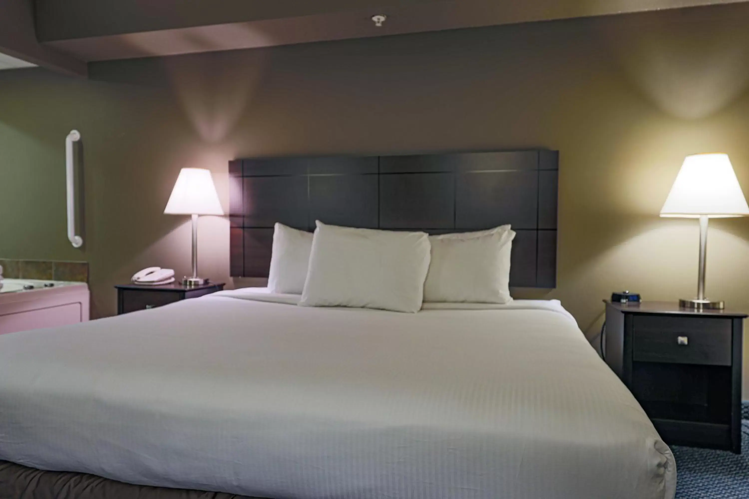 Bed in AmericInn by Wyndham Lincoln South