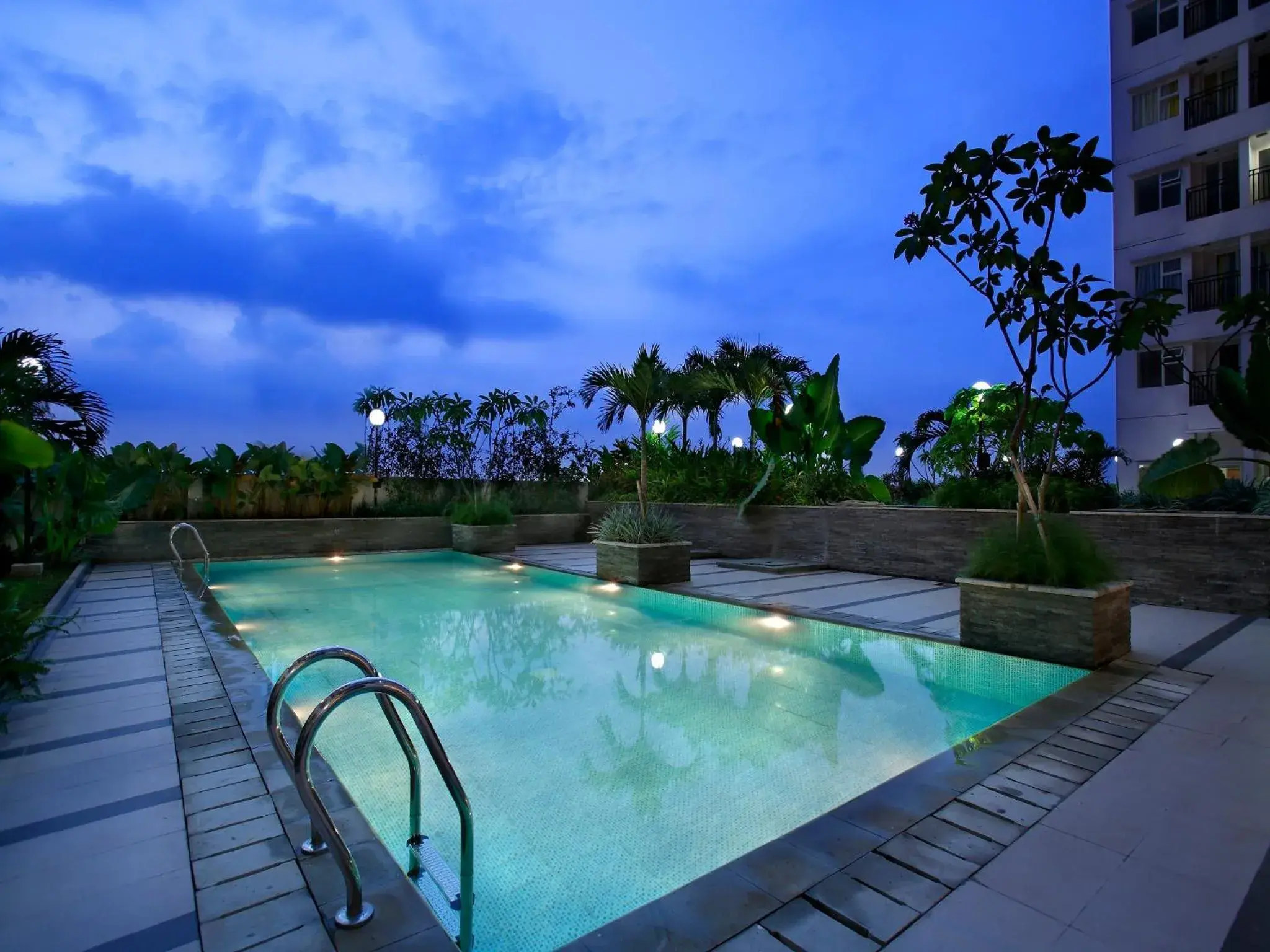 Facade/entrance, Swimming Pool in Hotel Santika Depok