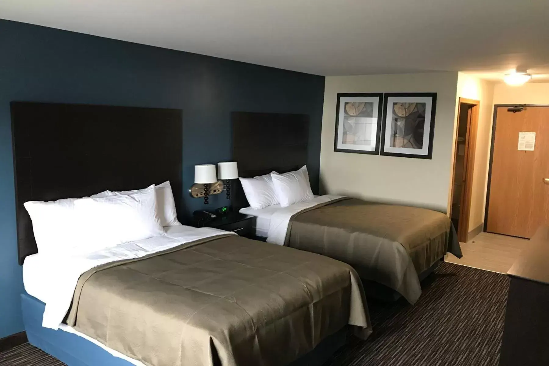 Bed in AmericInn by Wyndham Jefferson