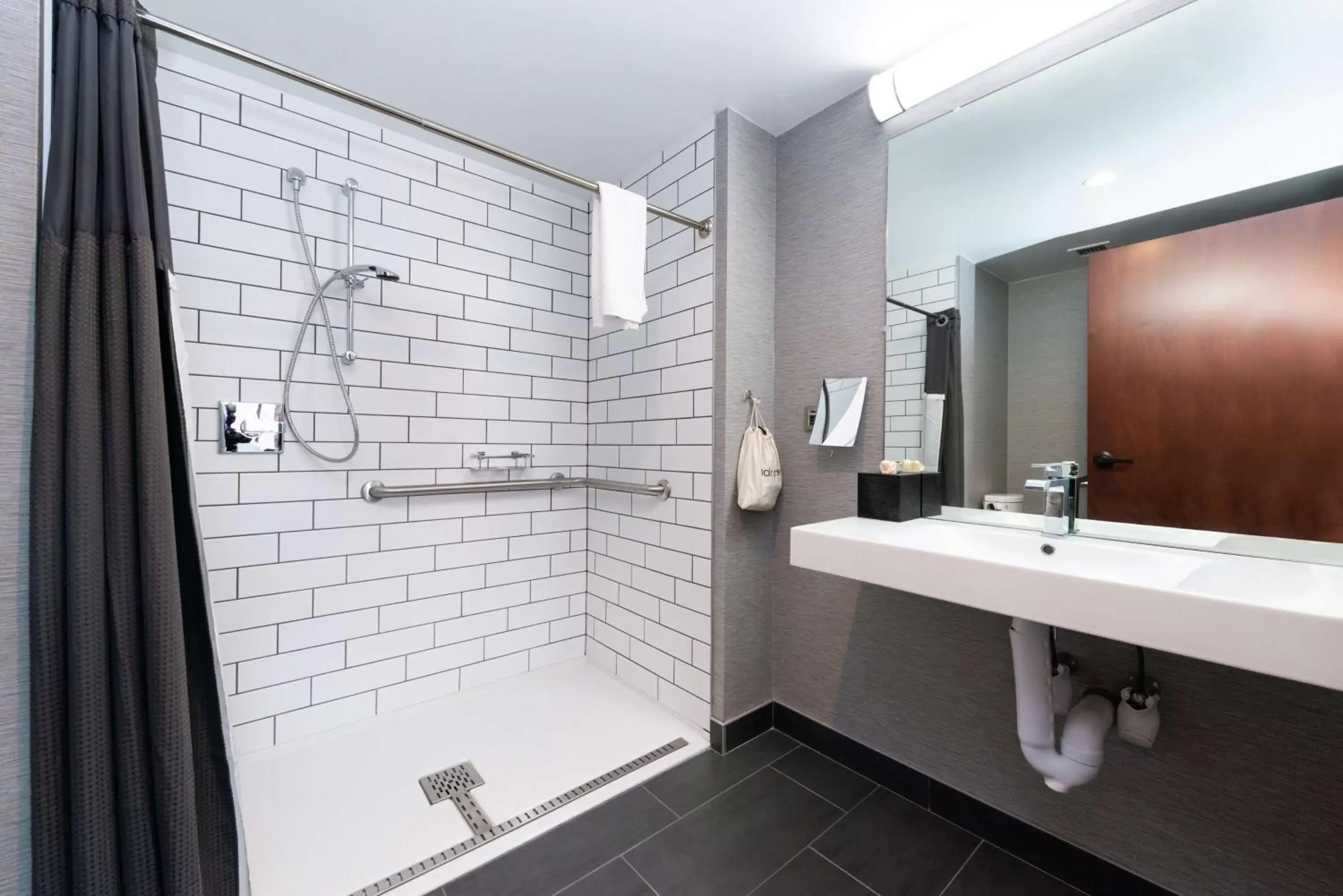 Bathroom in Joinery Hotel Pittsburgh, Curio Collection by Hilton