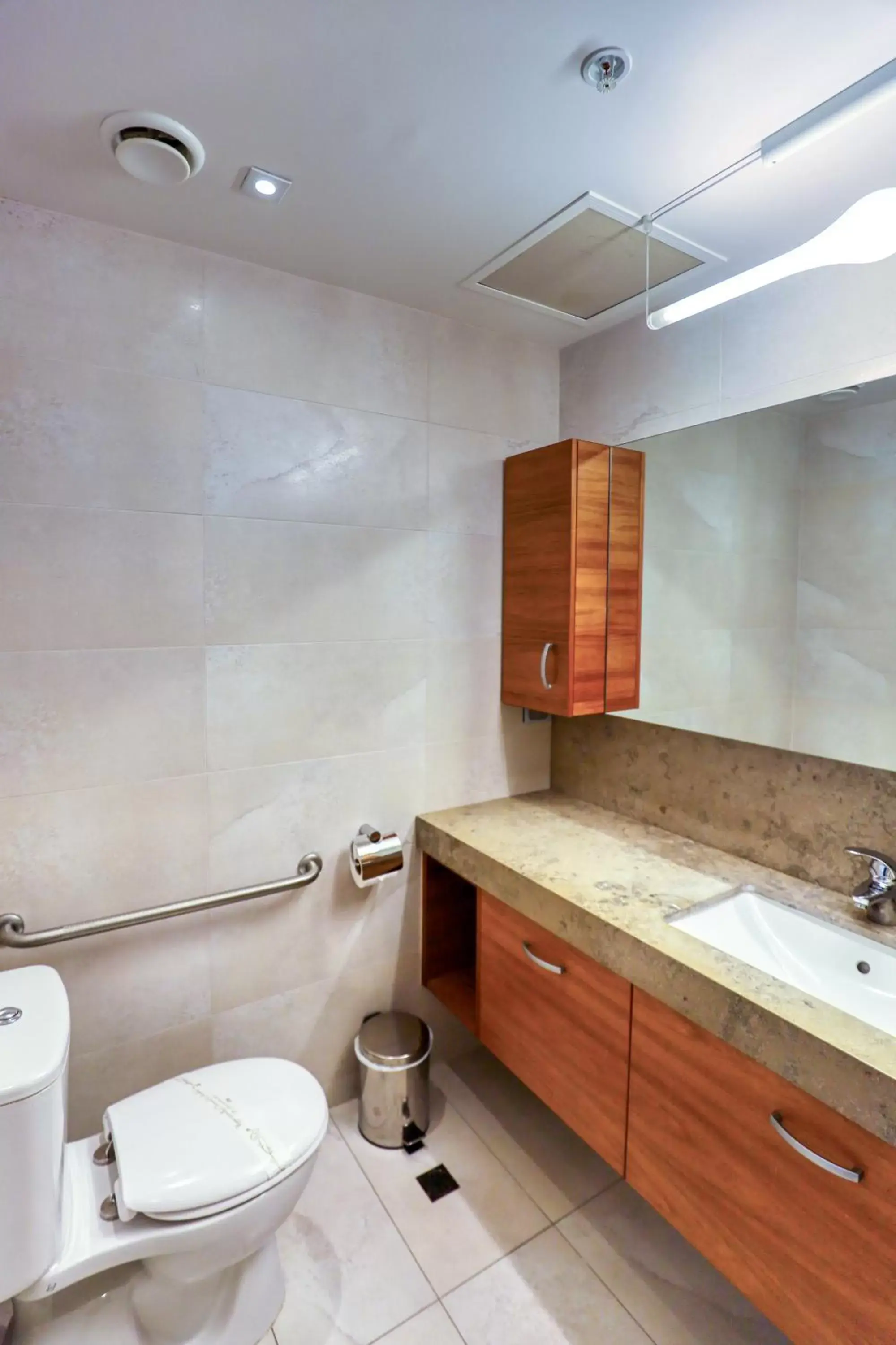 Bathroom in Ramada Suites by Wyndham Nautilus Orewa