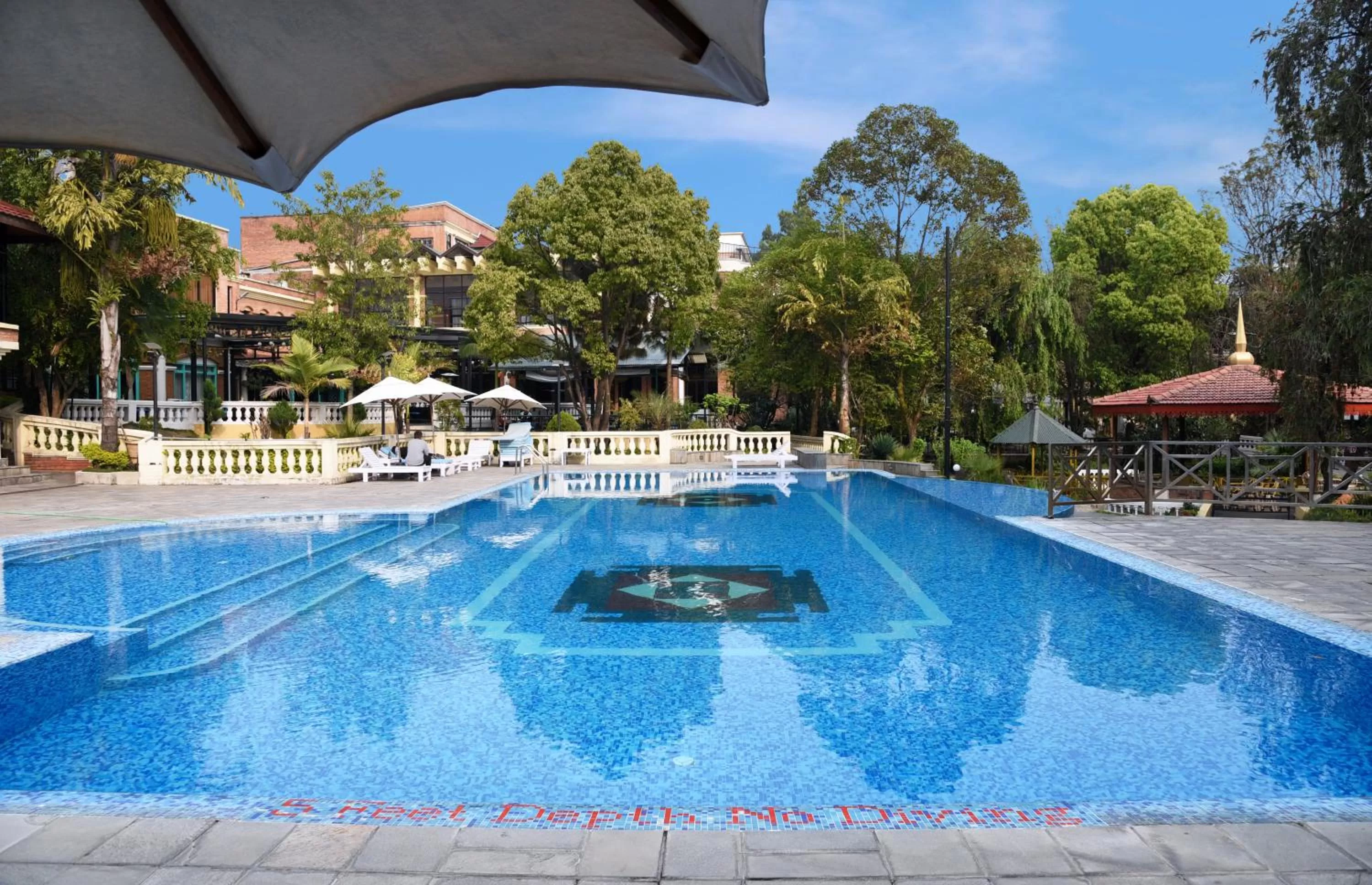 Swimming pool in Park Village Resort by KGH Group