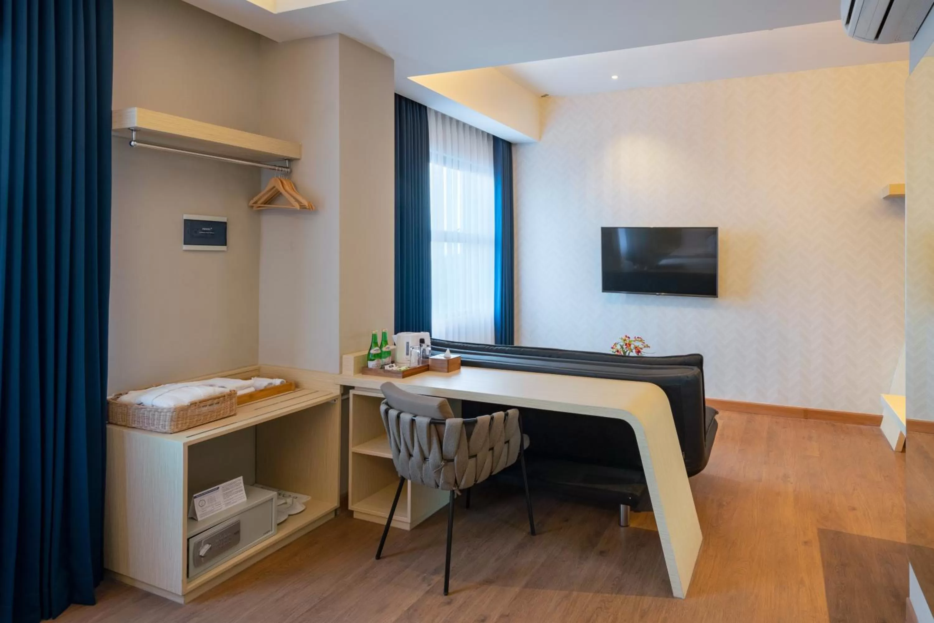 Living room, Bed in Luminor Hotel Airport Sidoarjo By WH , Best Choice and Strategic Location with a Rooftop area in Town